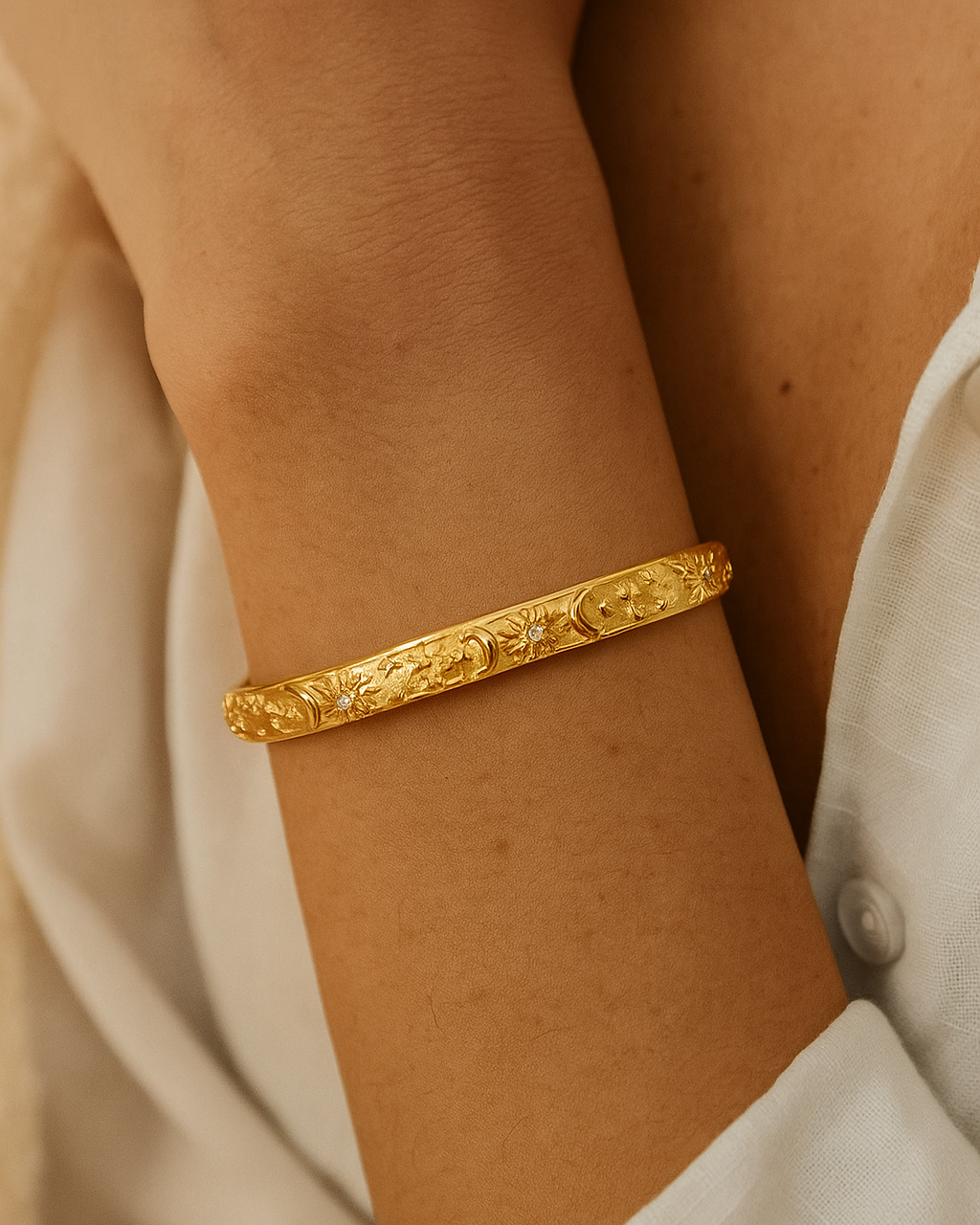 Manjaras Nina gold-plated cuff bracelet on wrist