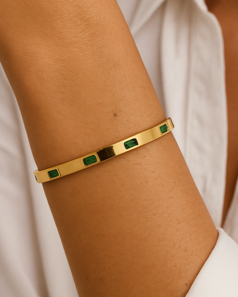 Gold bracelet with green stones