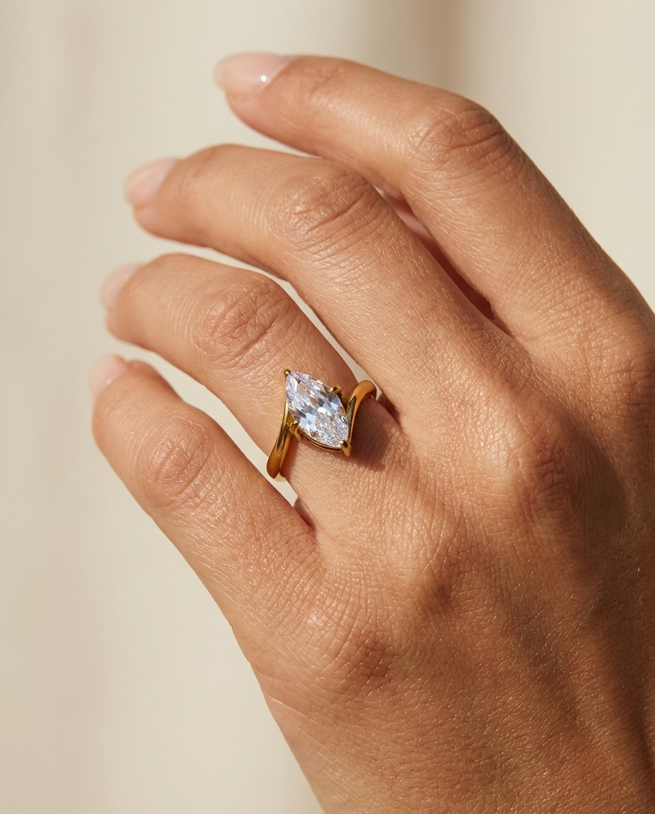 Giselle Marquise Ring worn on hand gold solitaire