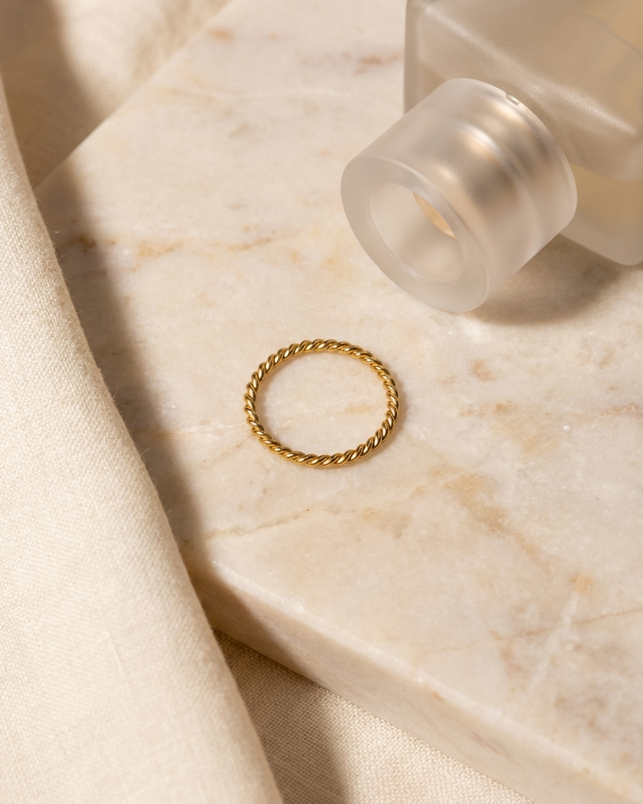 Sabine Ring flatlay on marble gold band
