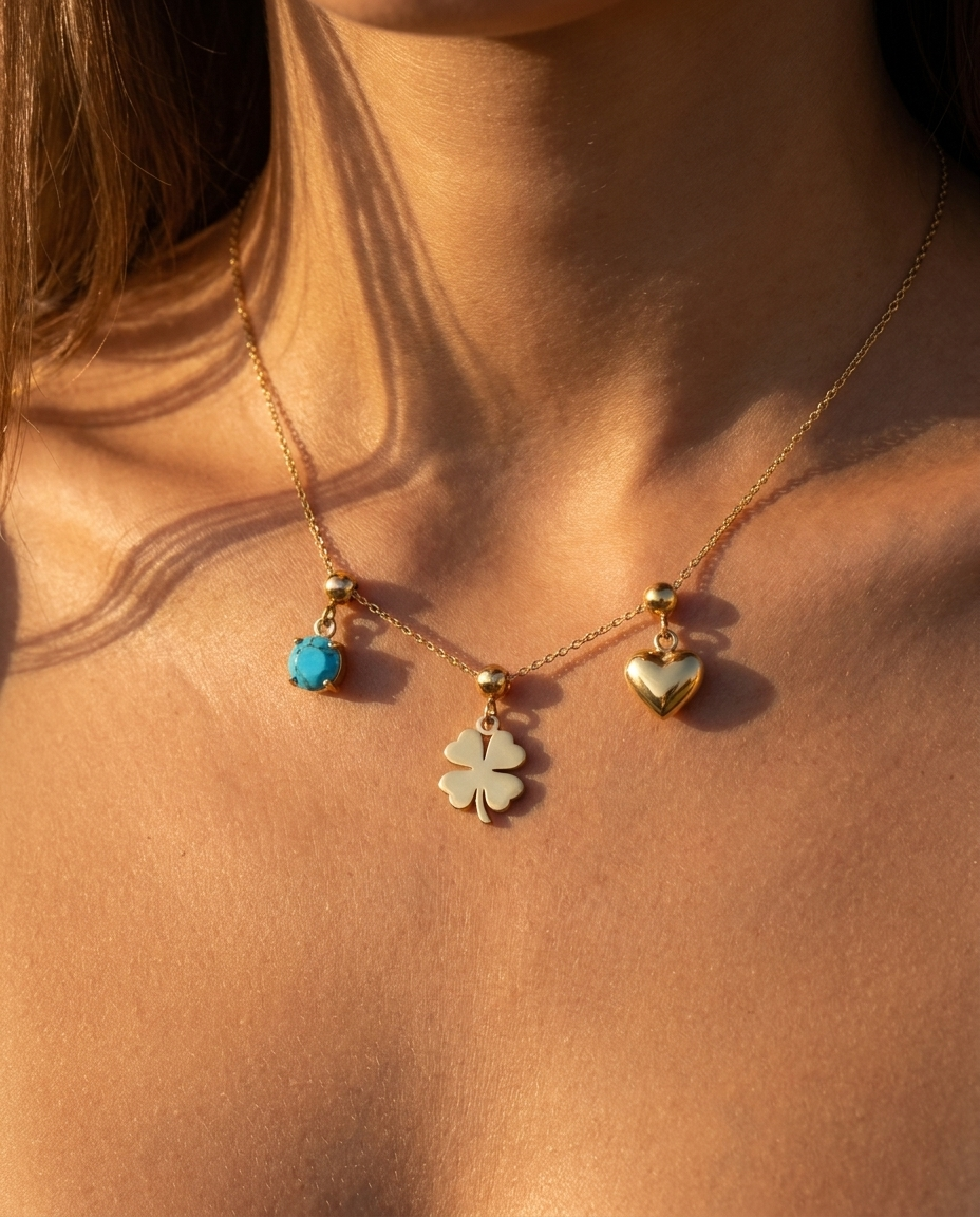 Four-leaf clover charm styled with December turquoise and heart on chain