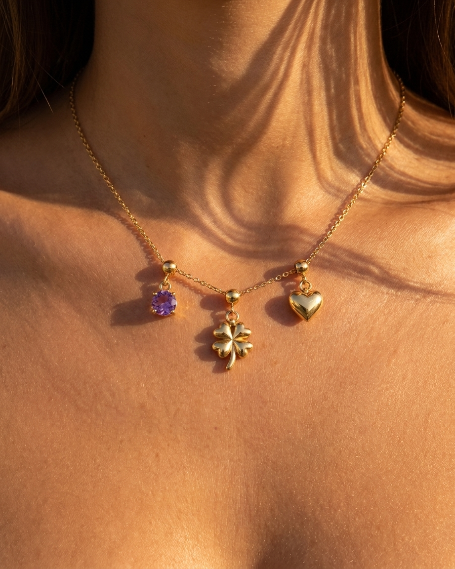 Quatrefoil flower charm styled with February amethyst and heart on chain