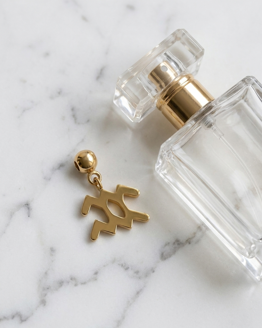 Gold zodiac Aquarius charm flatlay, marble