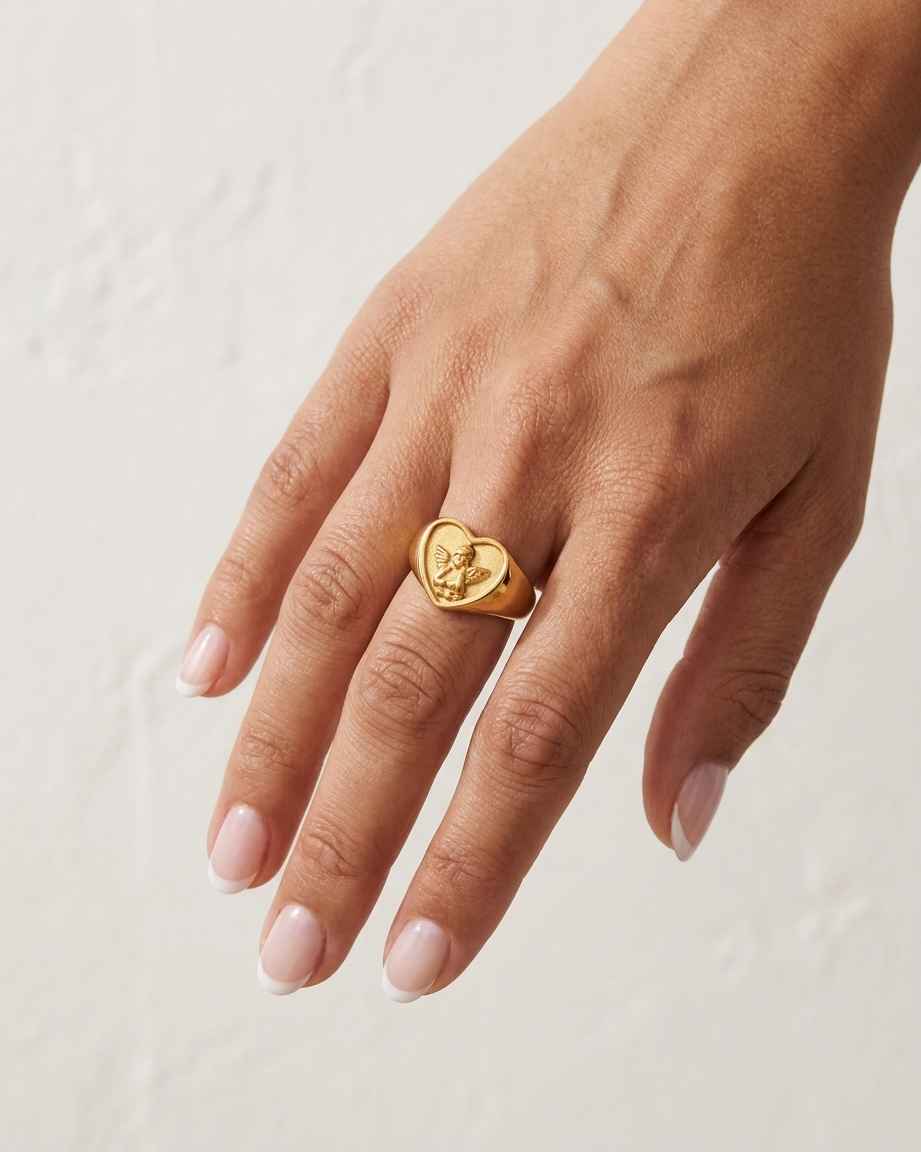 Angel Ring on hand against cream wall