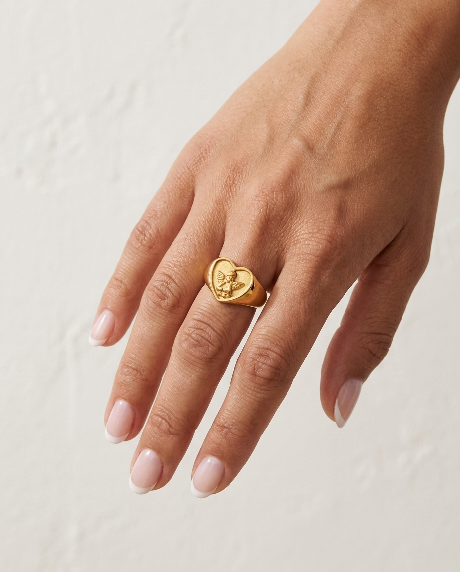 Angel Ring on hand against cream wall