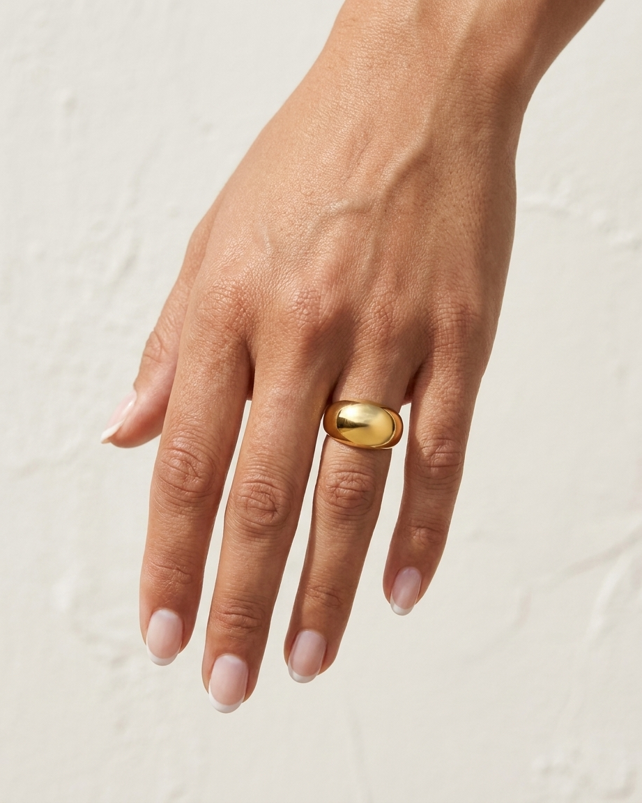 Elle Ring on hand against cream wall