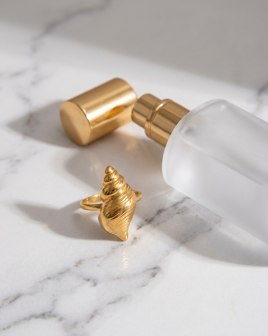 Marisol Golden Seashell Ring marble flatlay