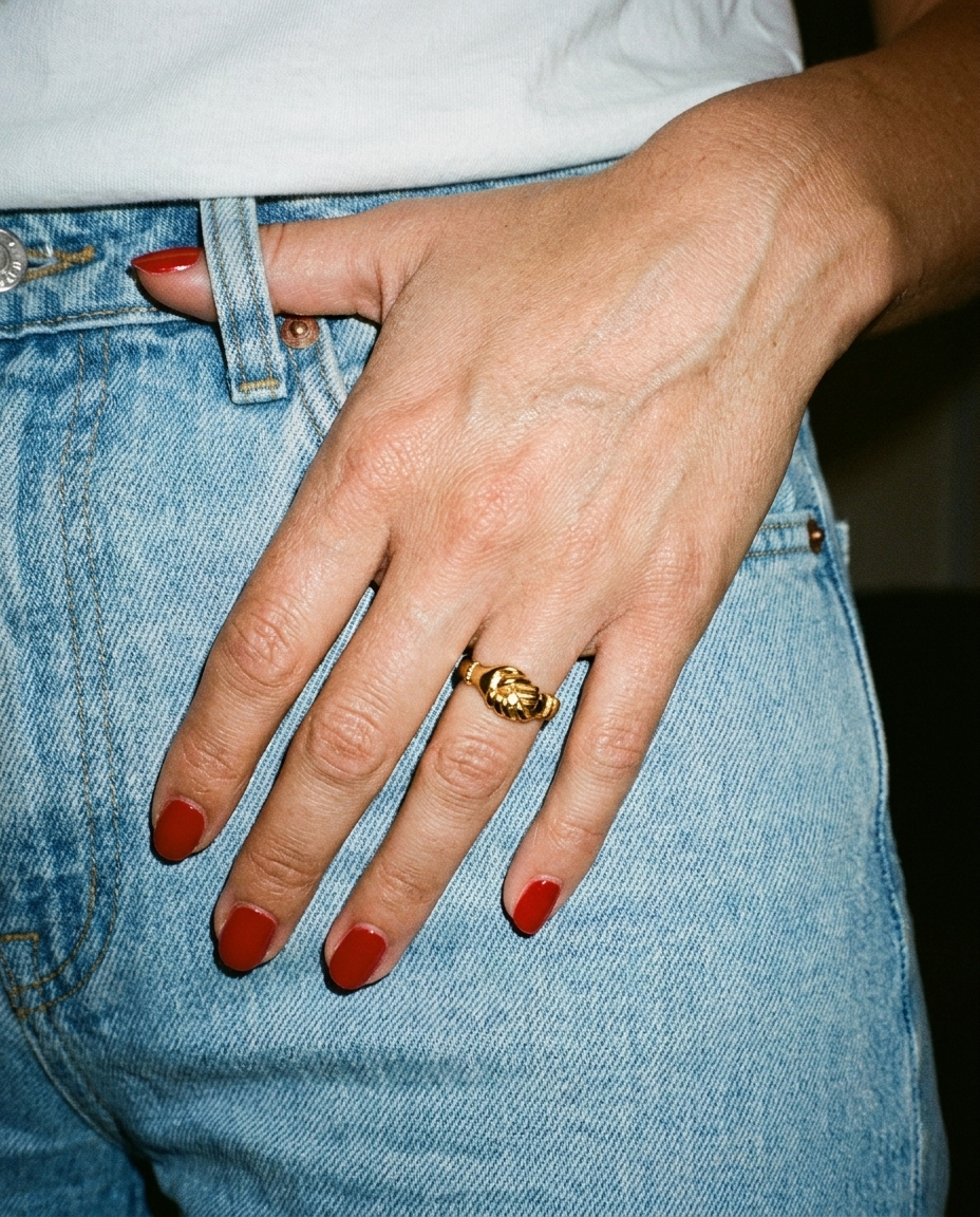 Gold Handshake Ring candid flash