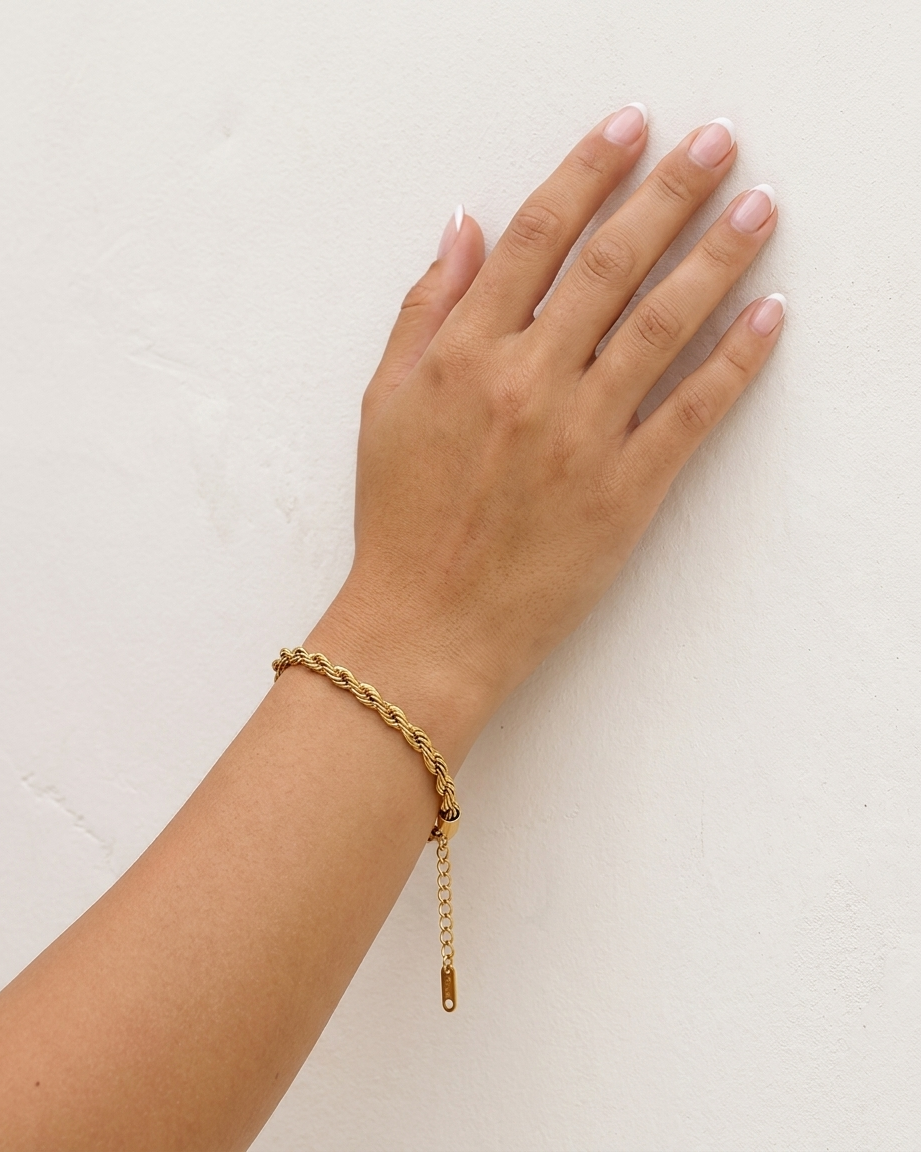 Gia Bracelet on wrist plaster wall