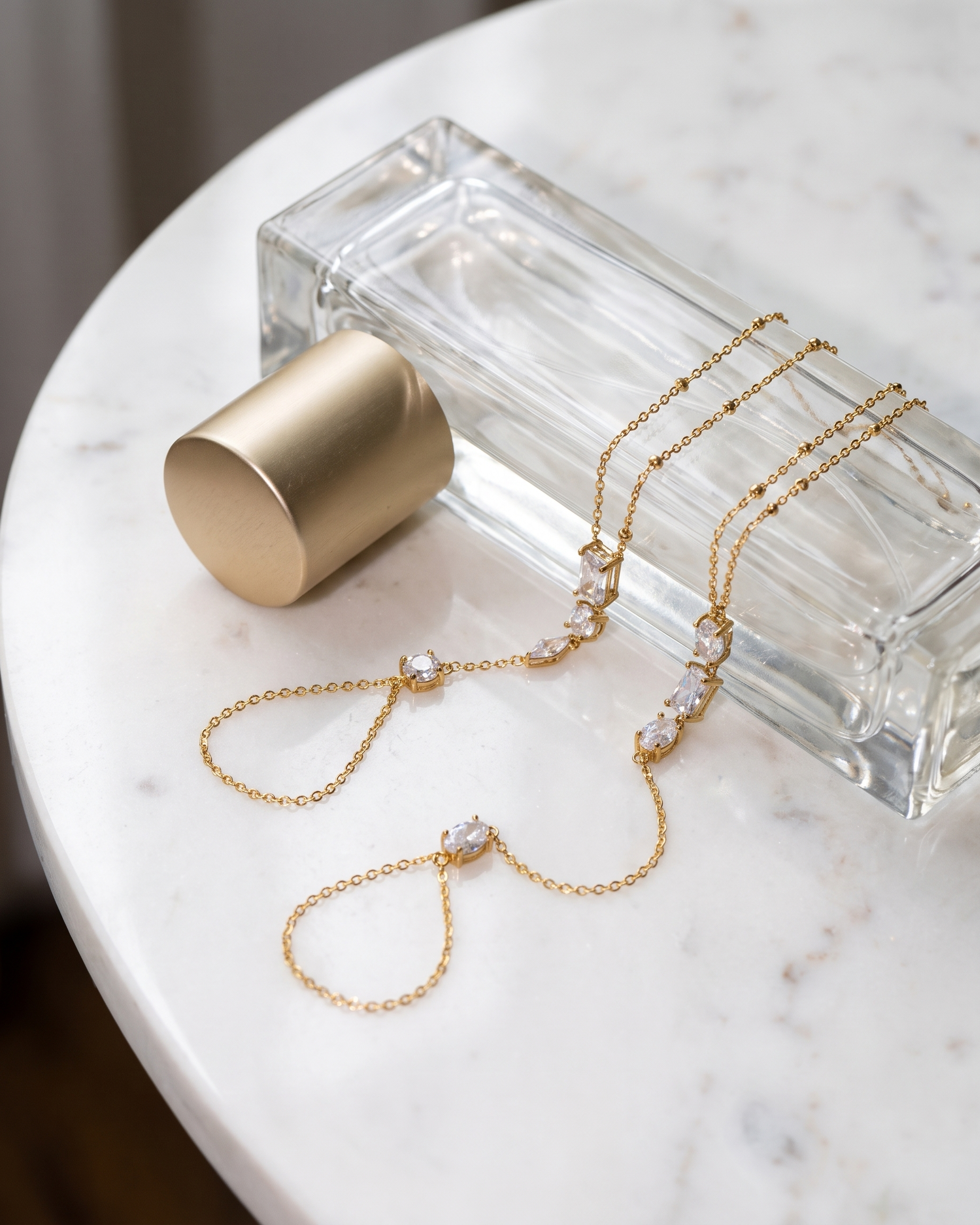 Nadia Hand Chain flatlay on white marble
