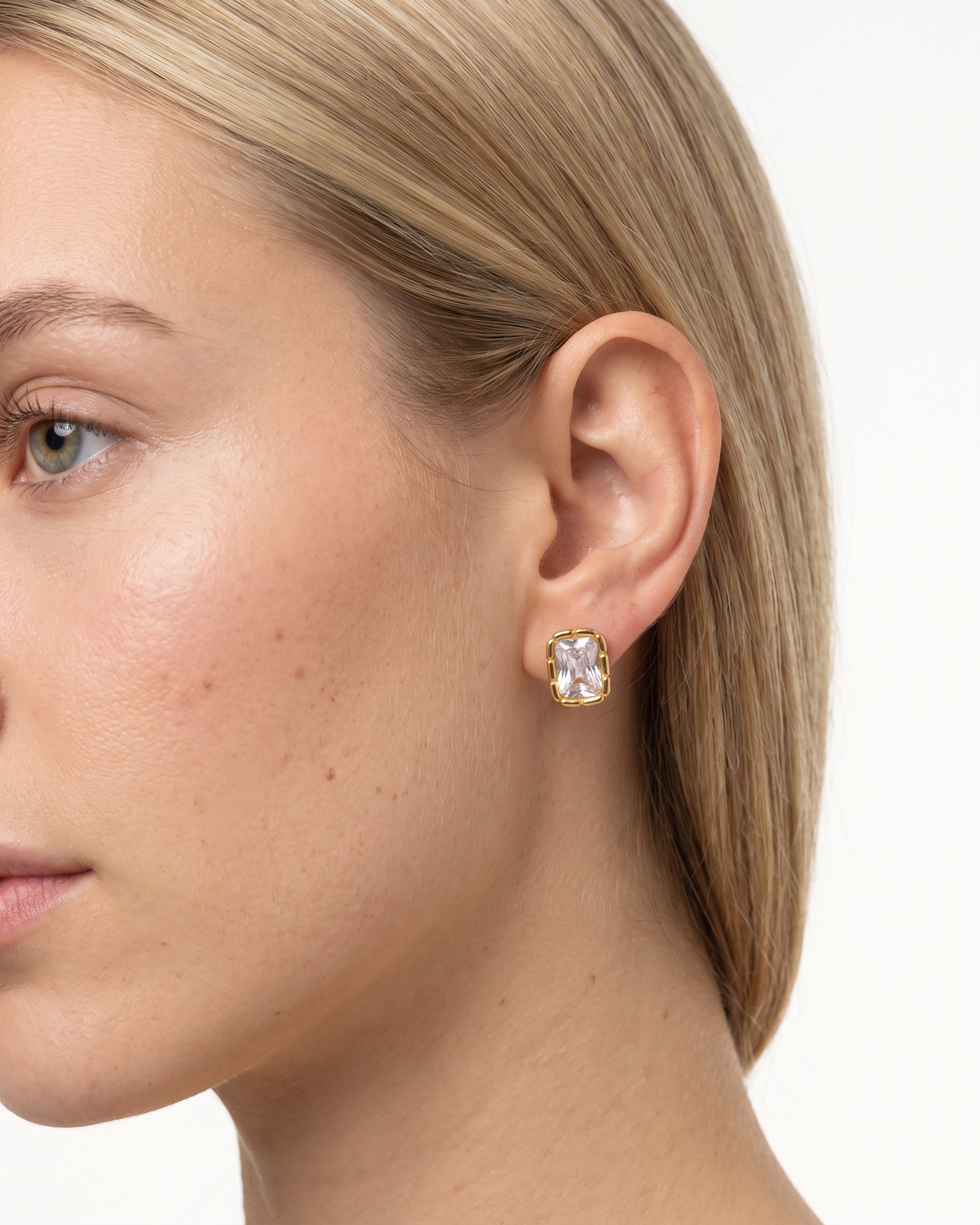 Adèle rectangle stud earring worn on ear
