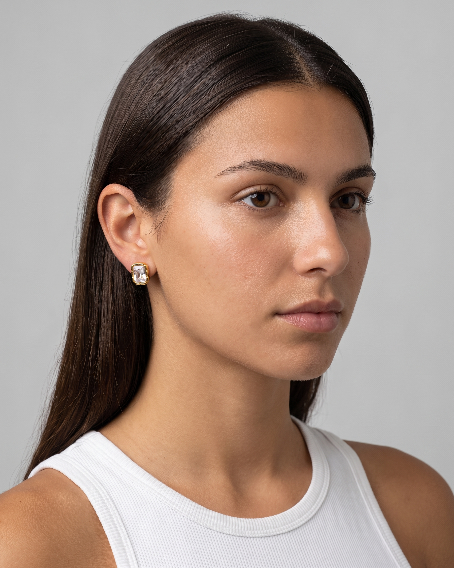 Adèle rectangle stud earring worn on ear