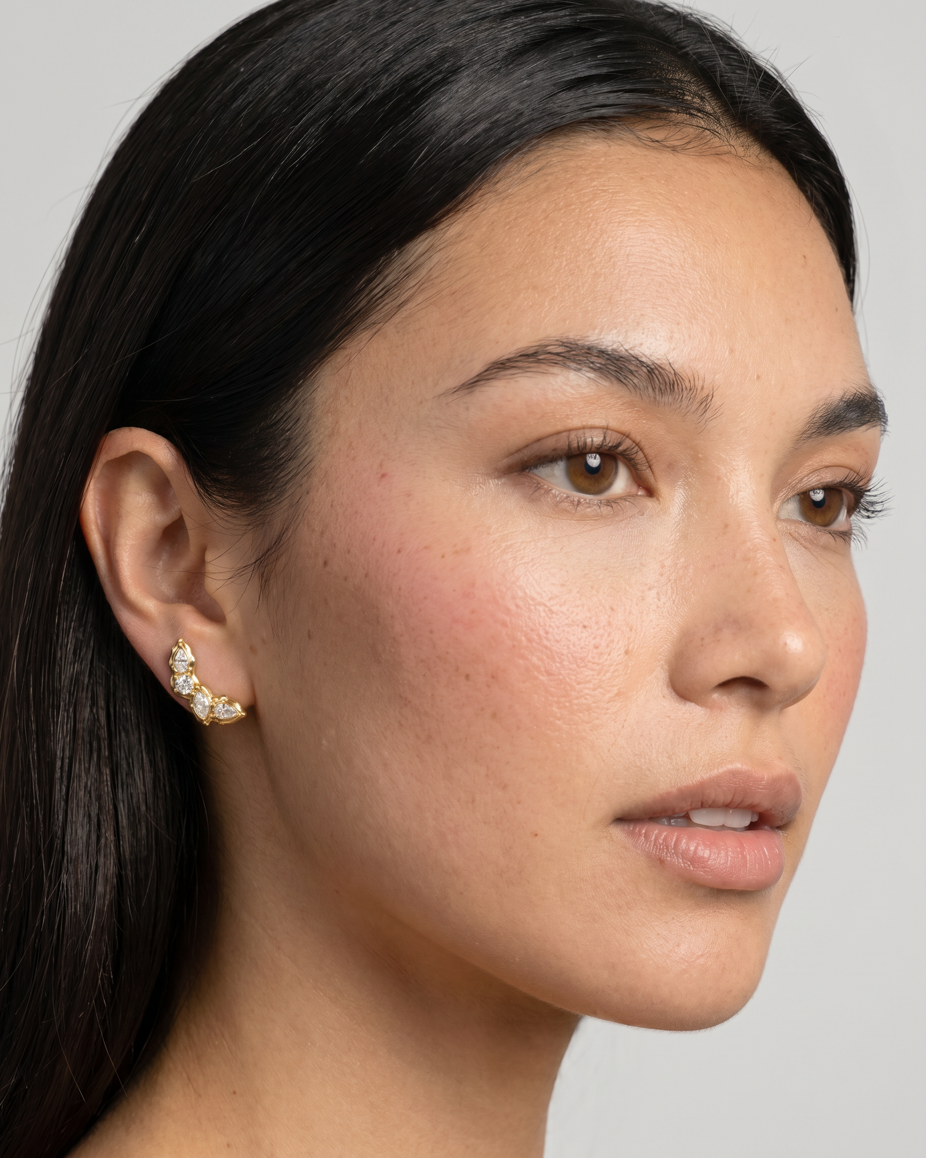 Laurel earrings worn on ear
