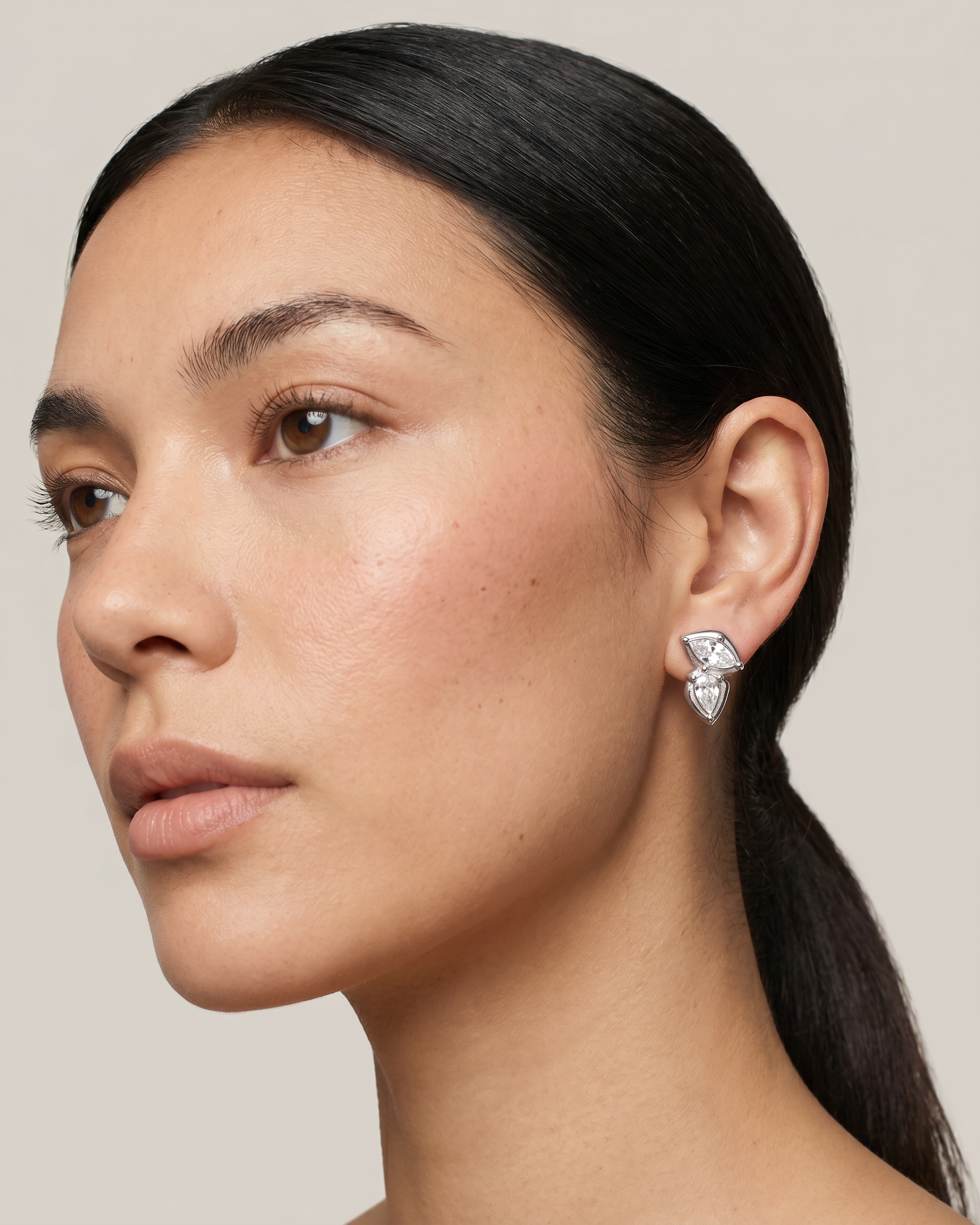 Fern silver earrings worn on ear