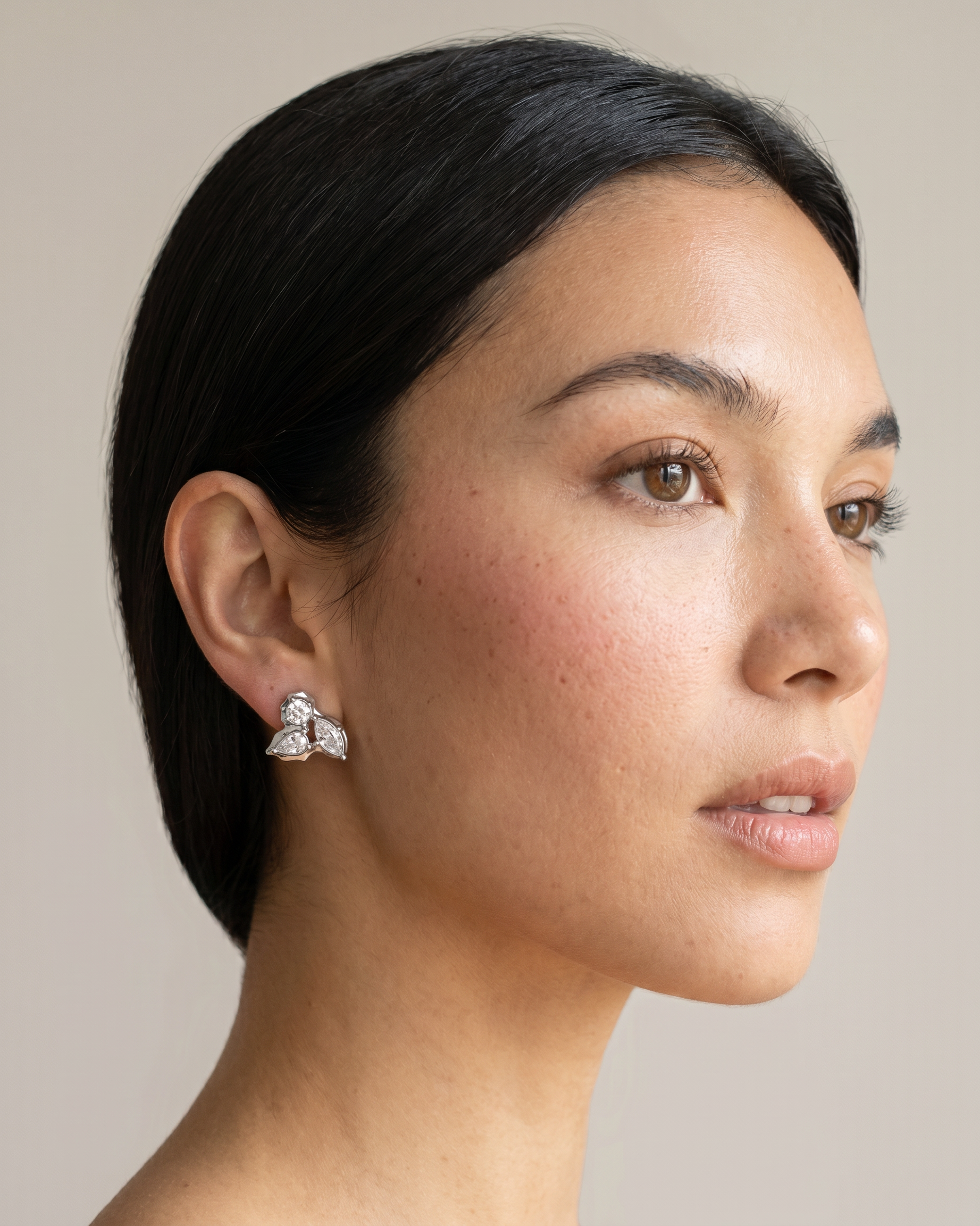 Willow silver earrings worn on ear