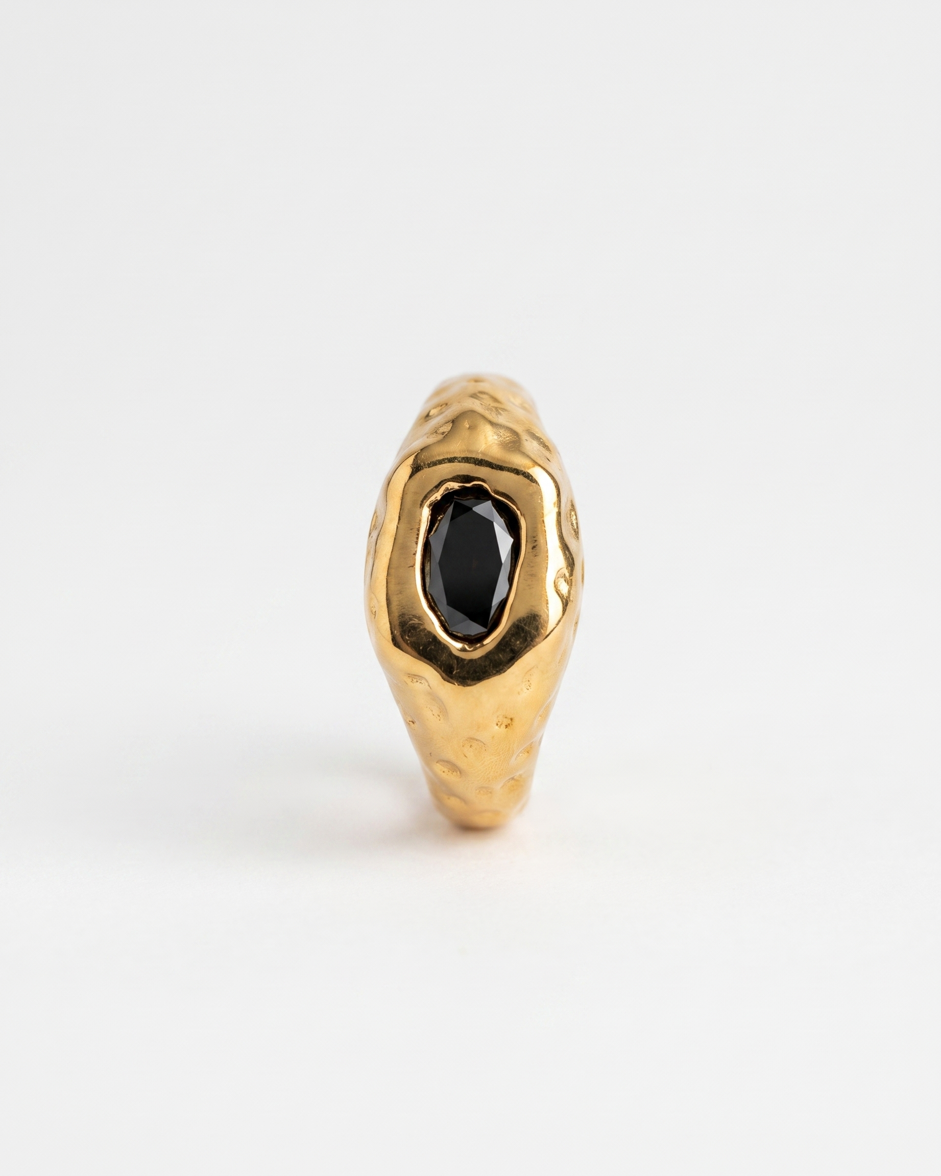 Odette Ring hero packshot - black zircon on embossed 18k gold-plated band
