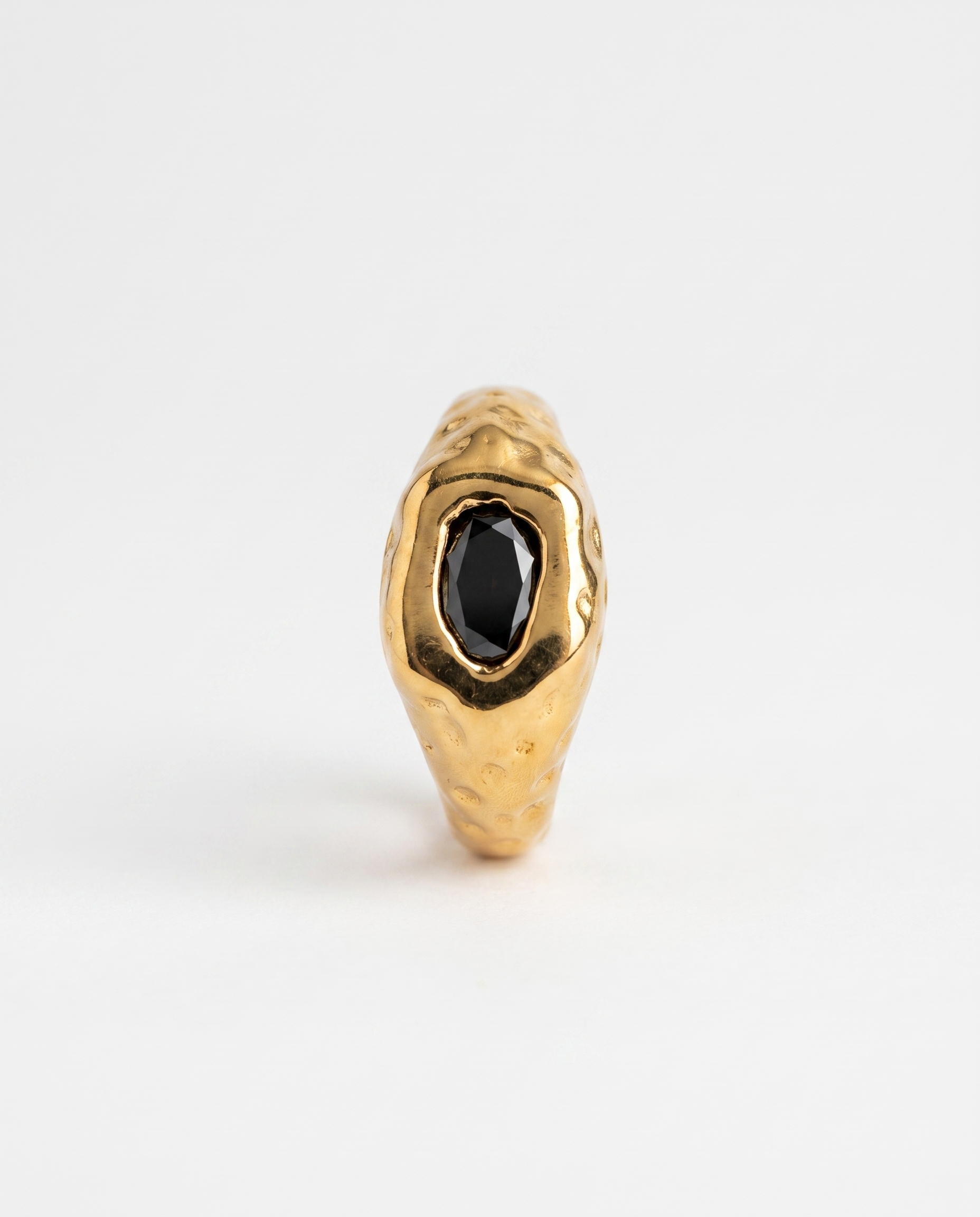 Odette Ring hero packshot - black zircon on embossed 18k gold-plated band