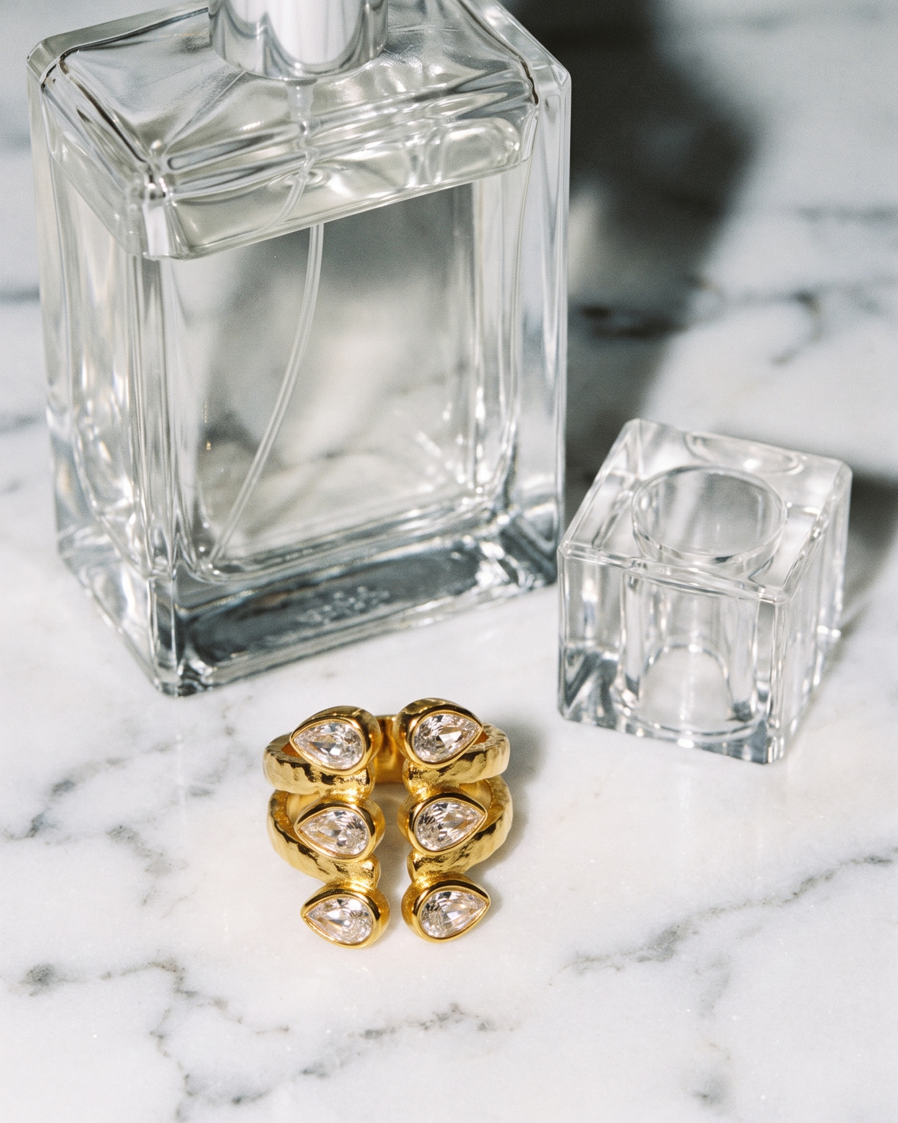Adele zircon open ring flatlay on marble
