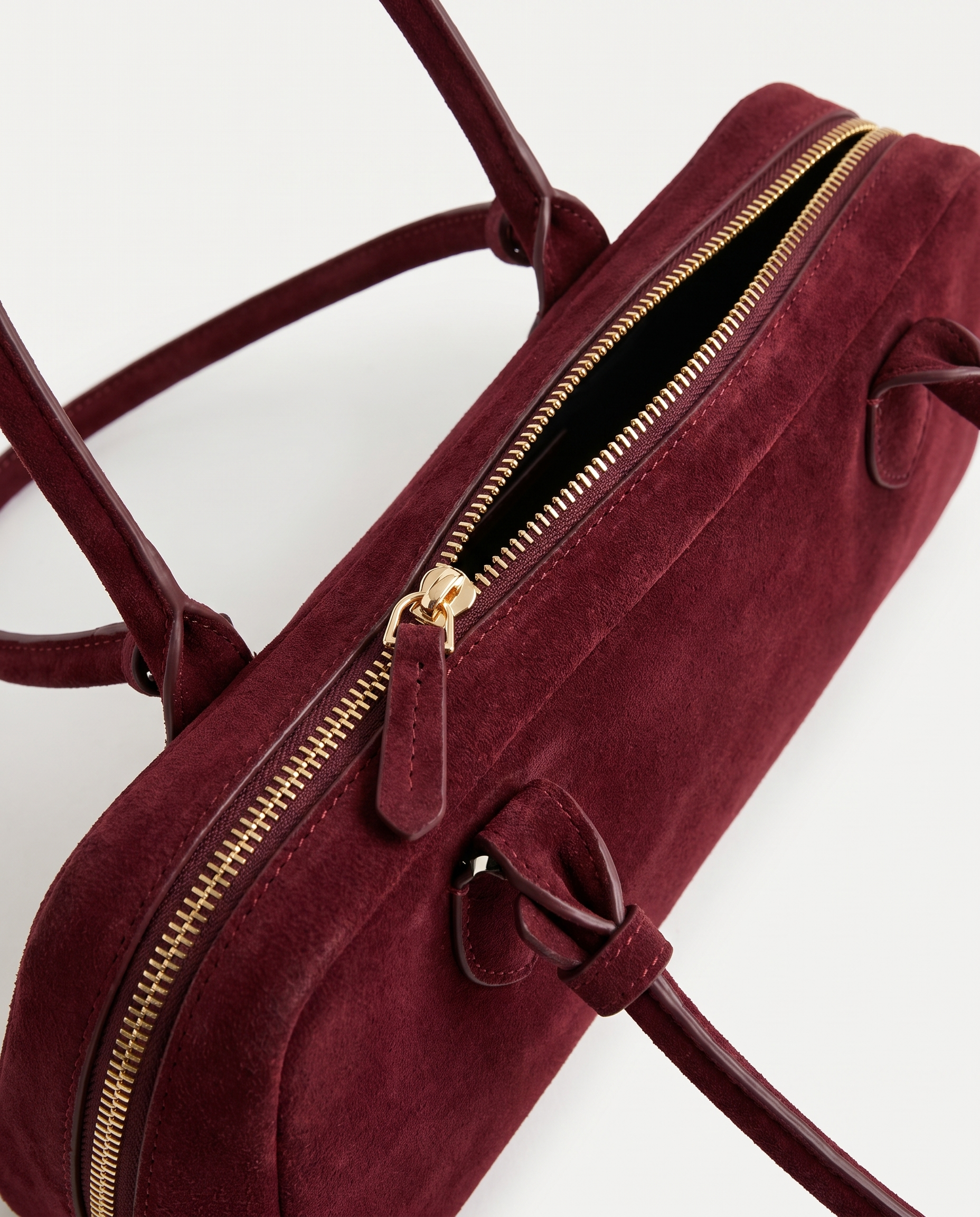 Salome burgundy suede baguette bag zip and tab detail