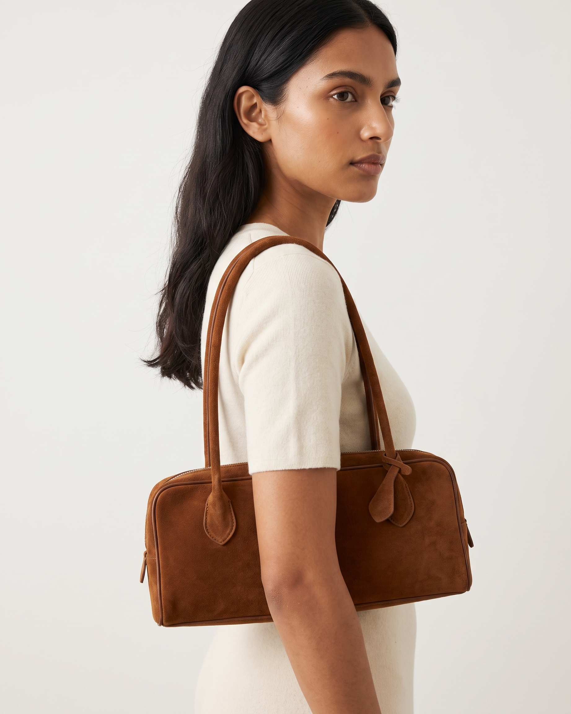 Salome cognac suede baguette bag worn under the arm