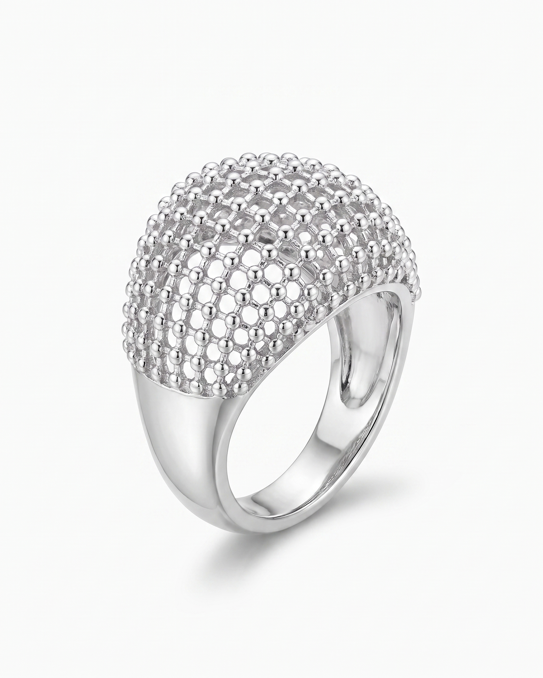 Maille openwork dome statement ring in silver on off white background