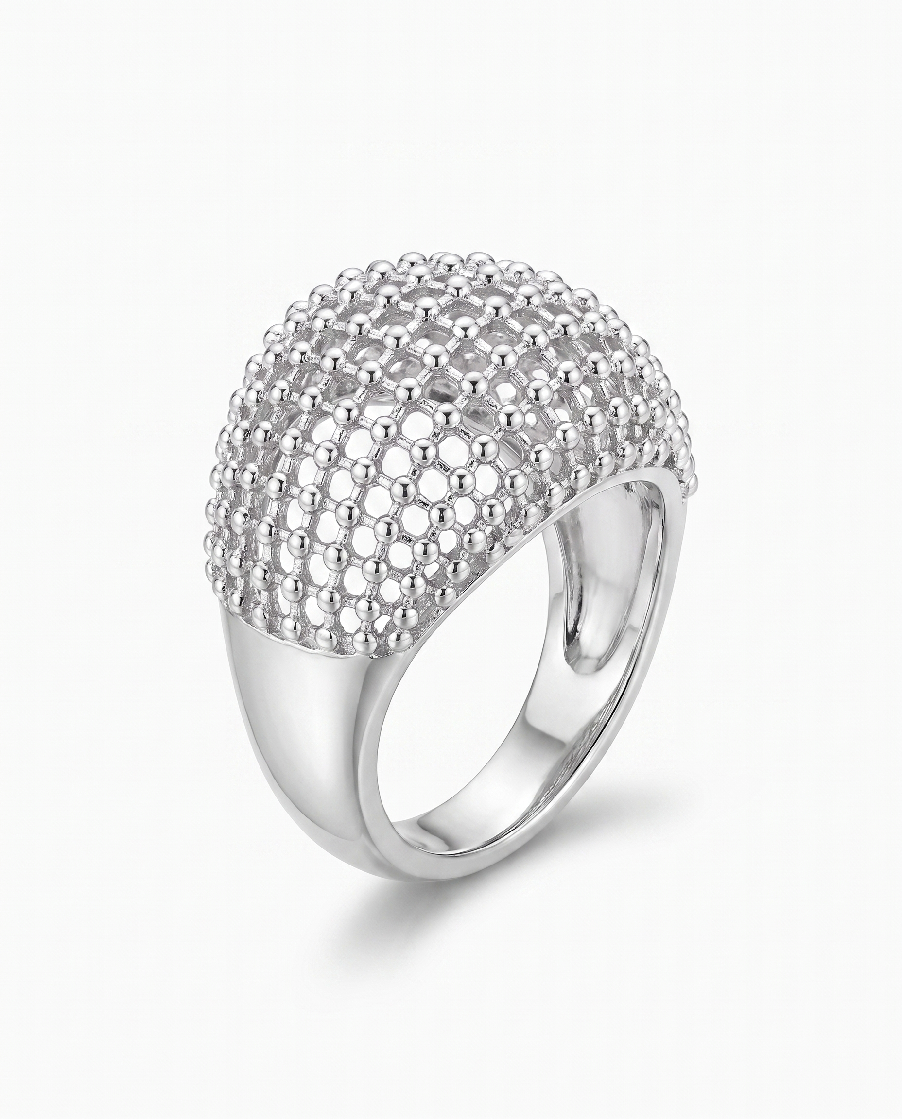 Maille openwork dome statement ring in silver on off white background