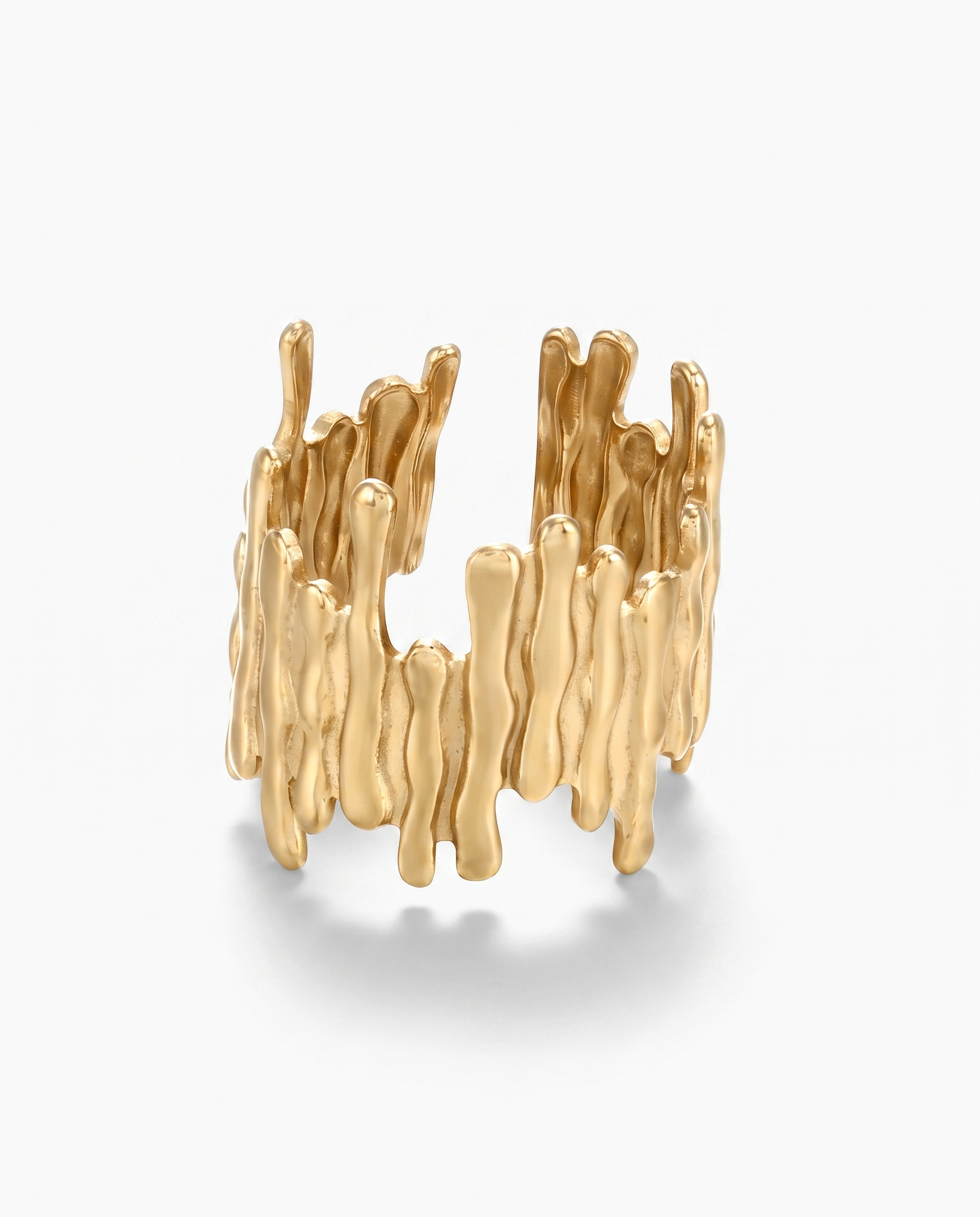 Ecorce bark textured open ring in gold on off white background