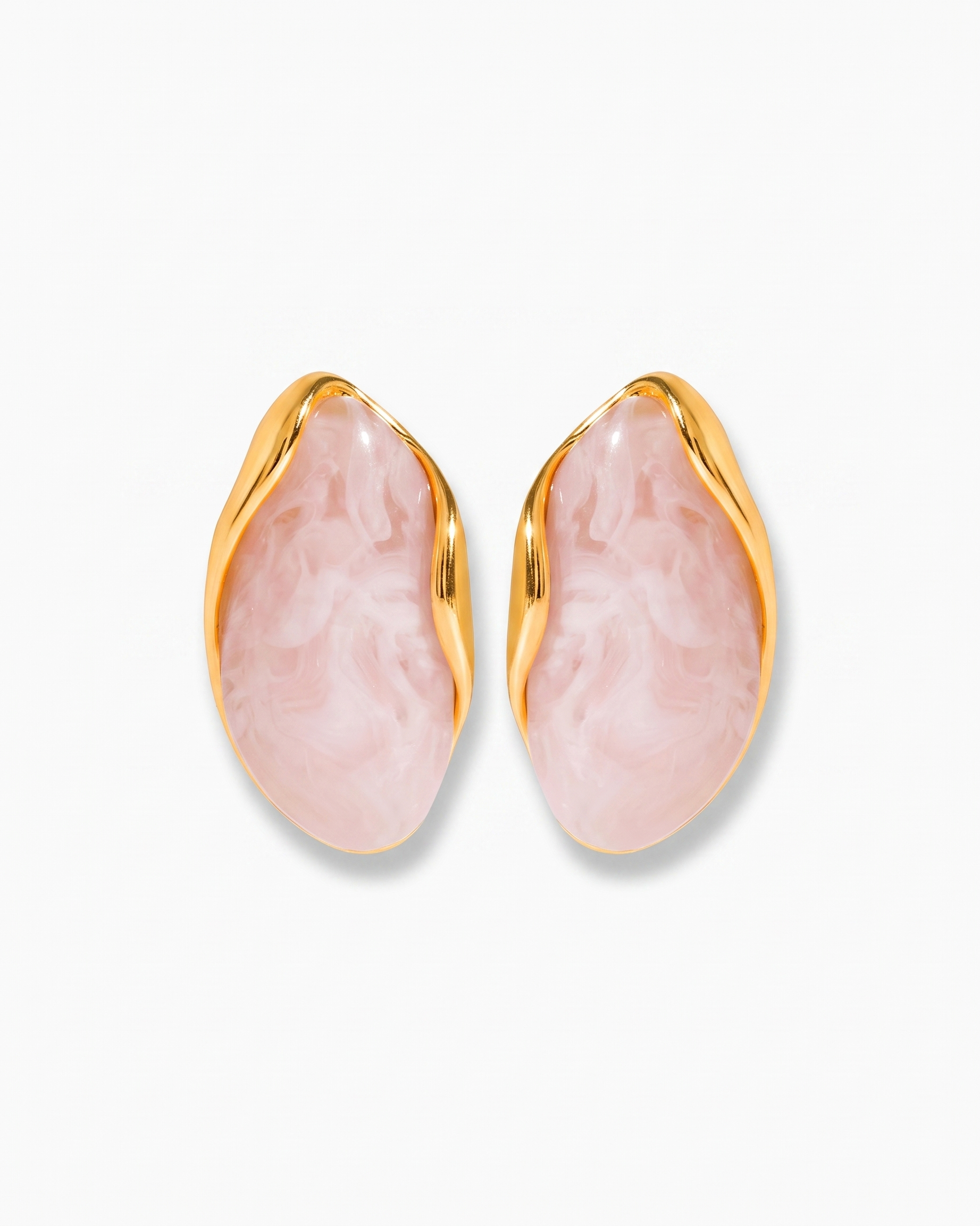 Galet blush pebble studs pair on off white background