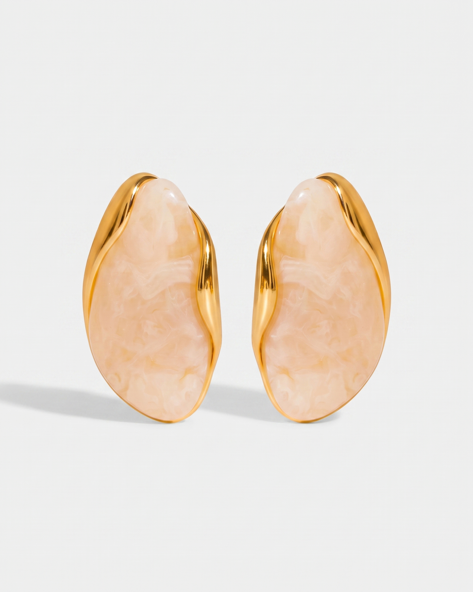 Galet cream pebble studs pair on off white background