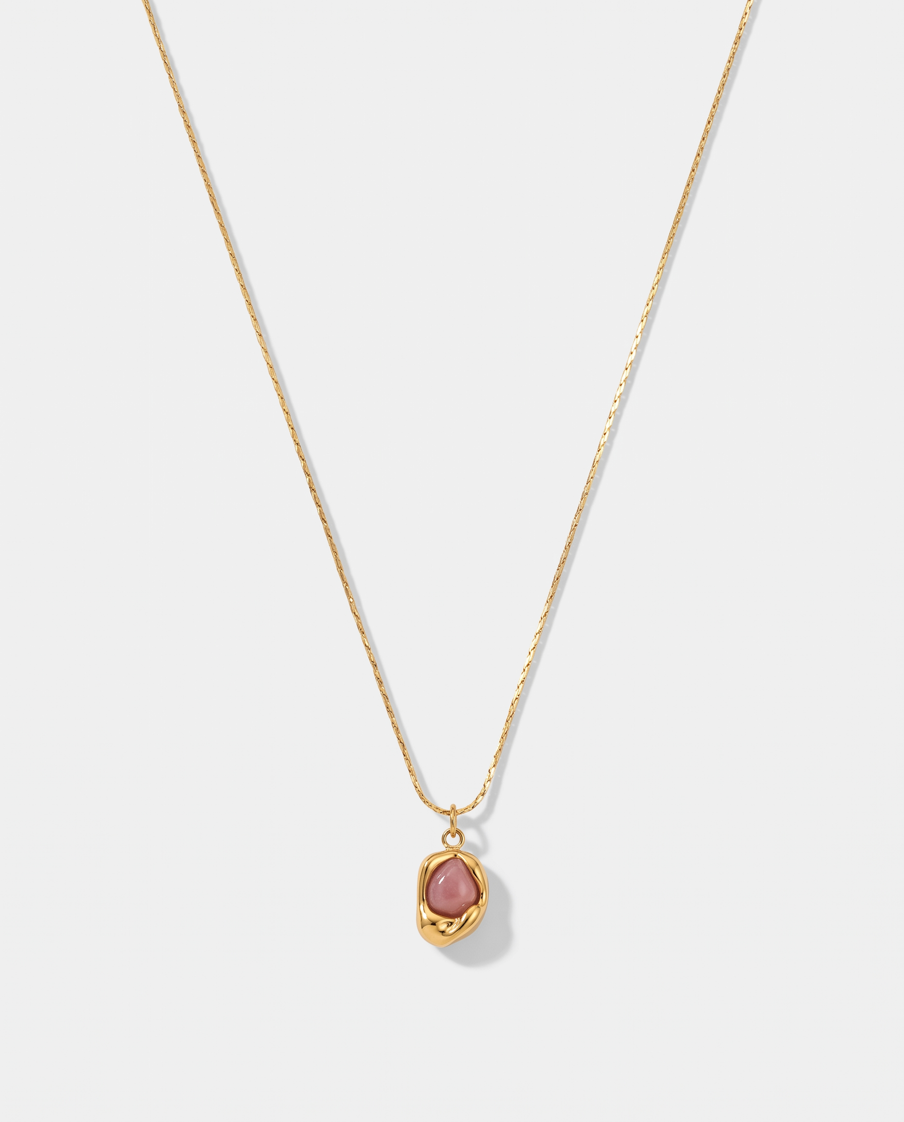 Caillou rose natural stone pendant gold necklace on off white background