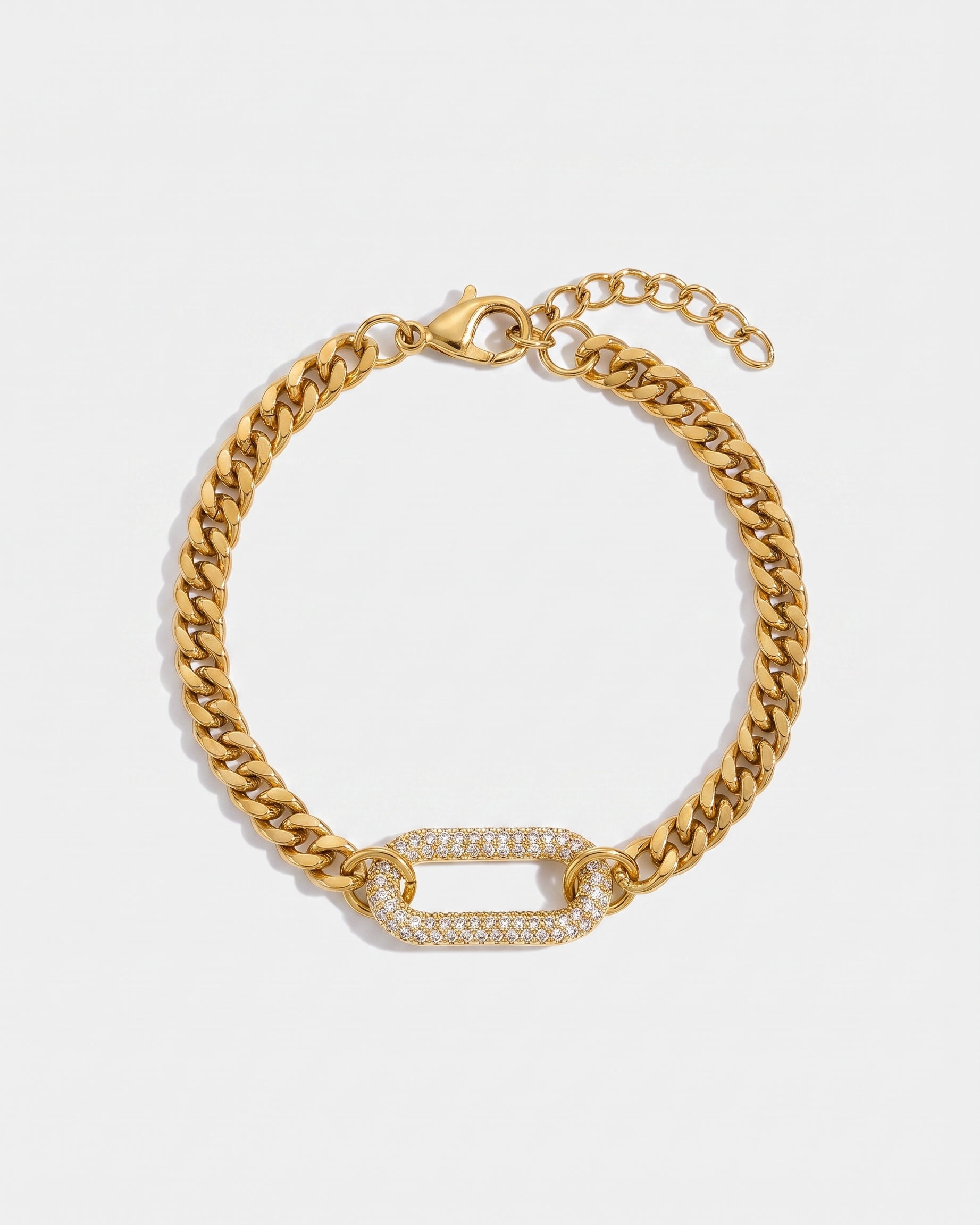 Pave gold curb chain bracelet with zircon link on off white background