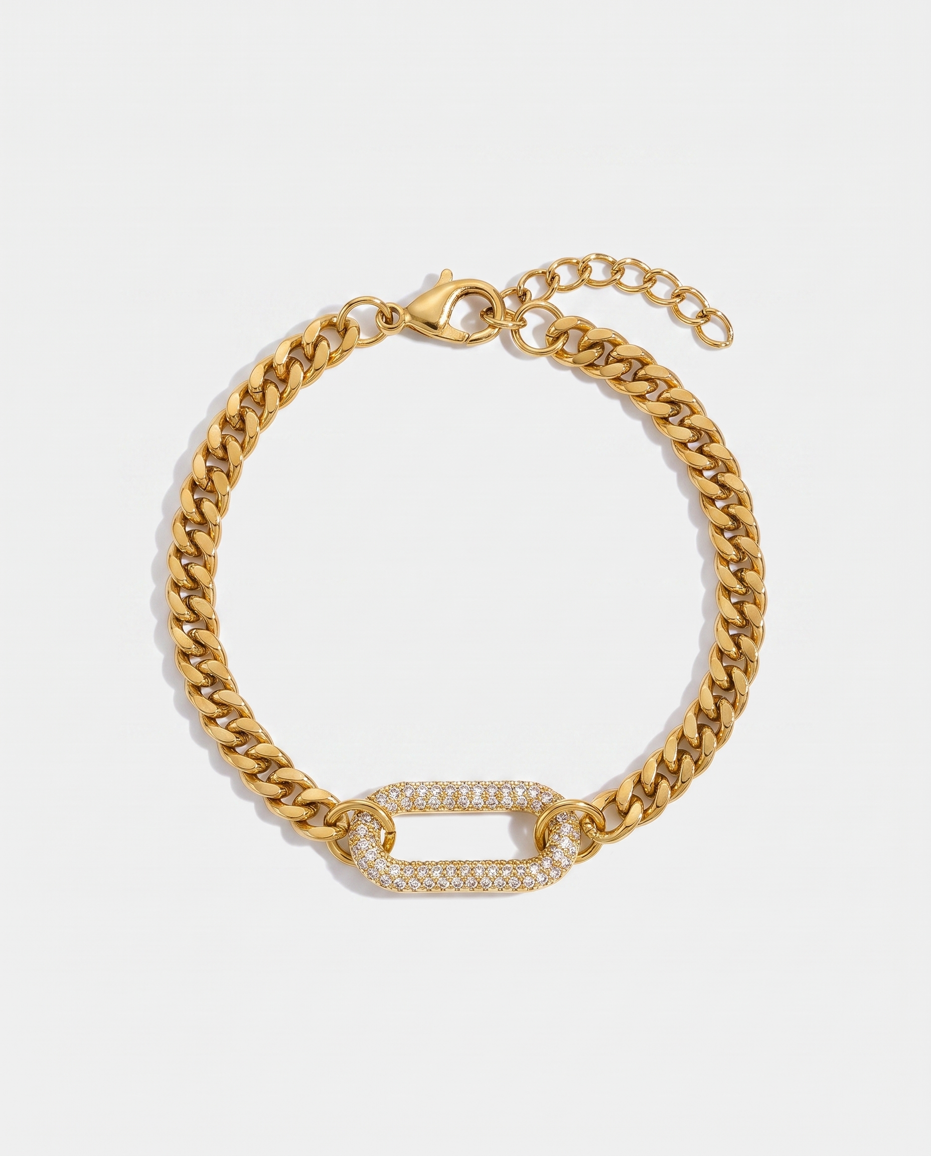 Pave gold curb chain bracelet with zircon link on off white background