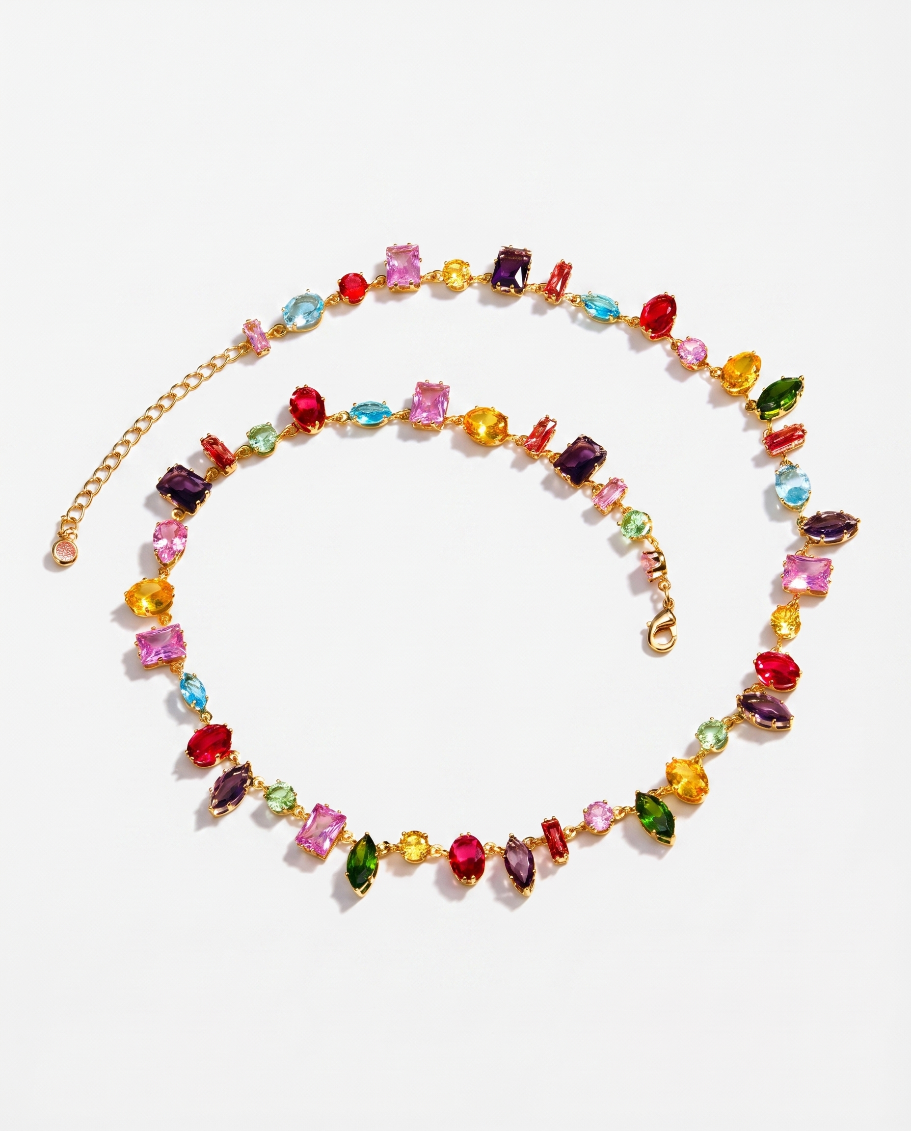 Arlequin multicoloured crystal zircon gold necklace on soft studio background