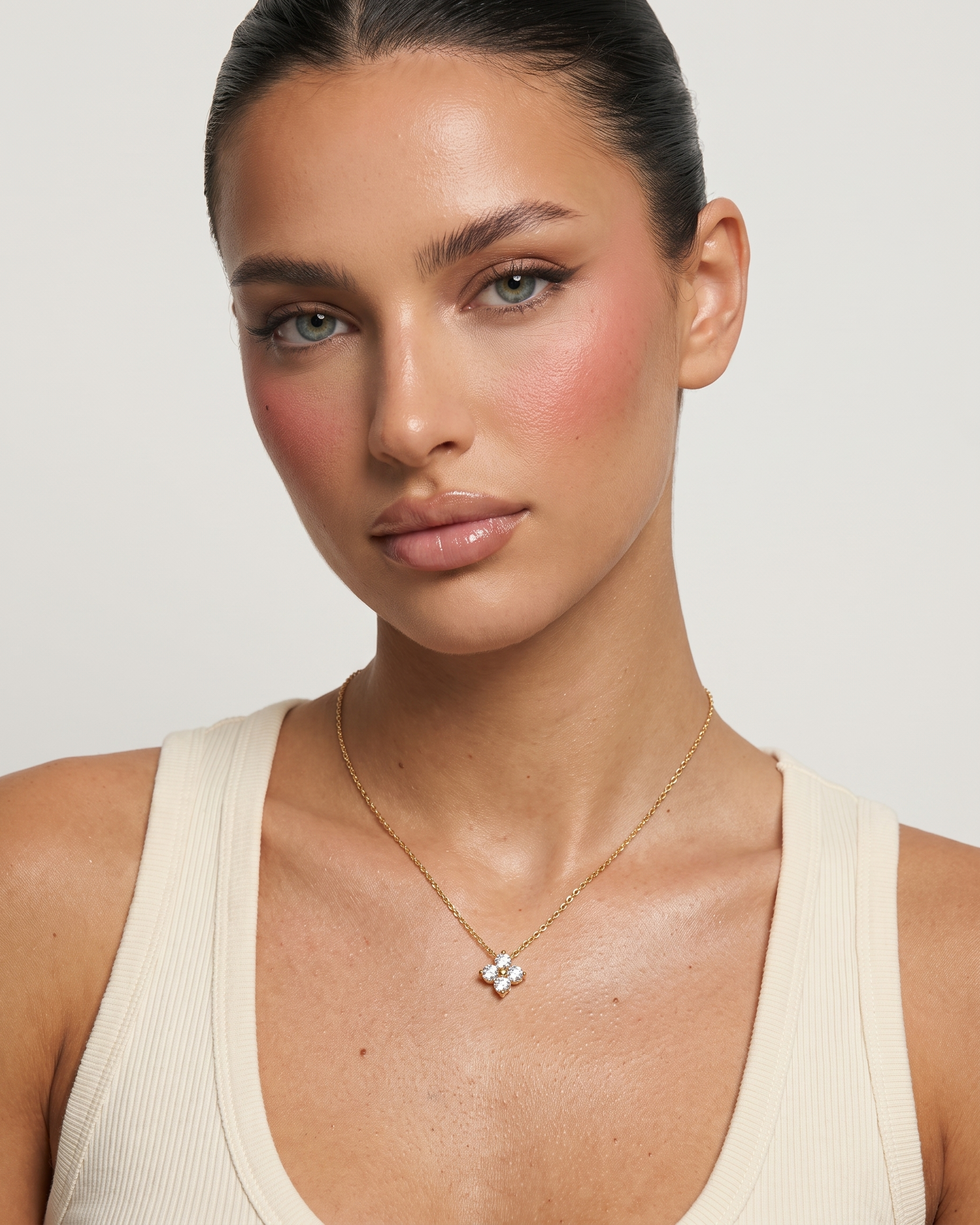 Fleur flower necklace worn on model at the collarbone