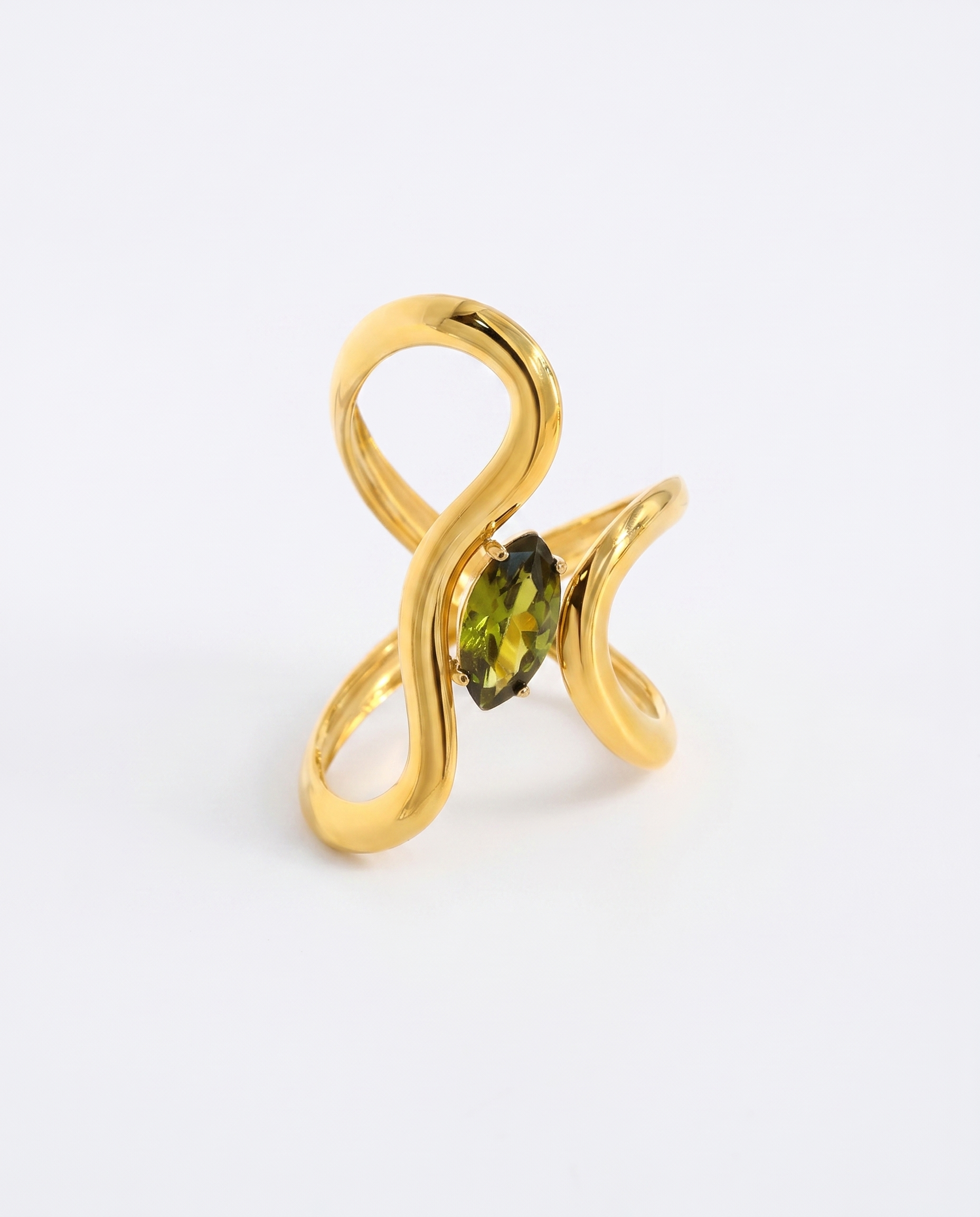 Jade green crystal irregular gold ring on soft studio background