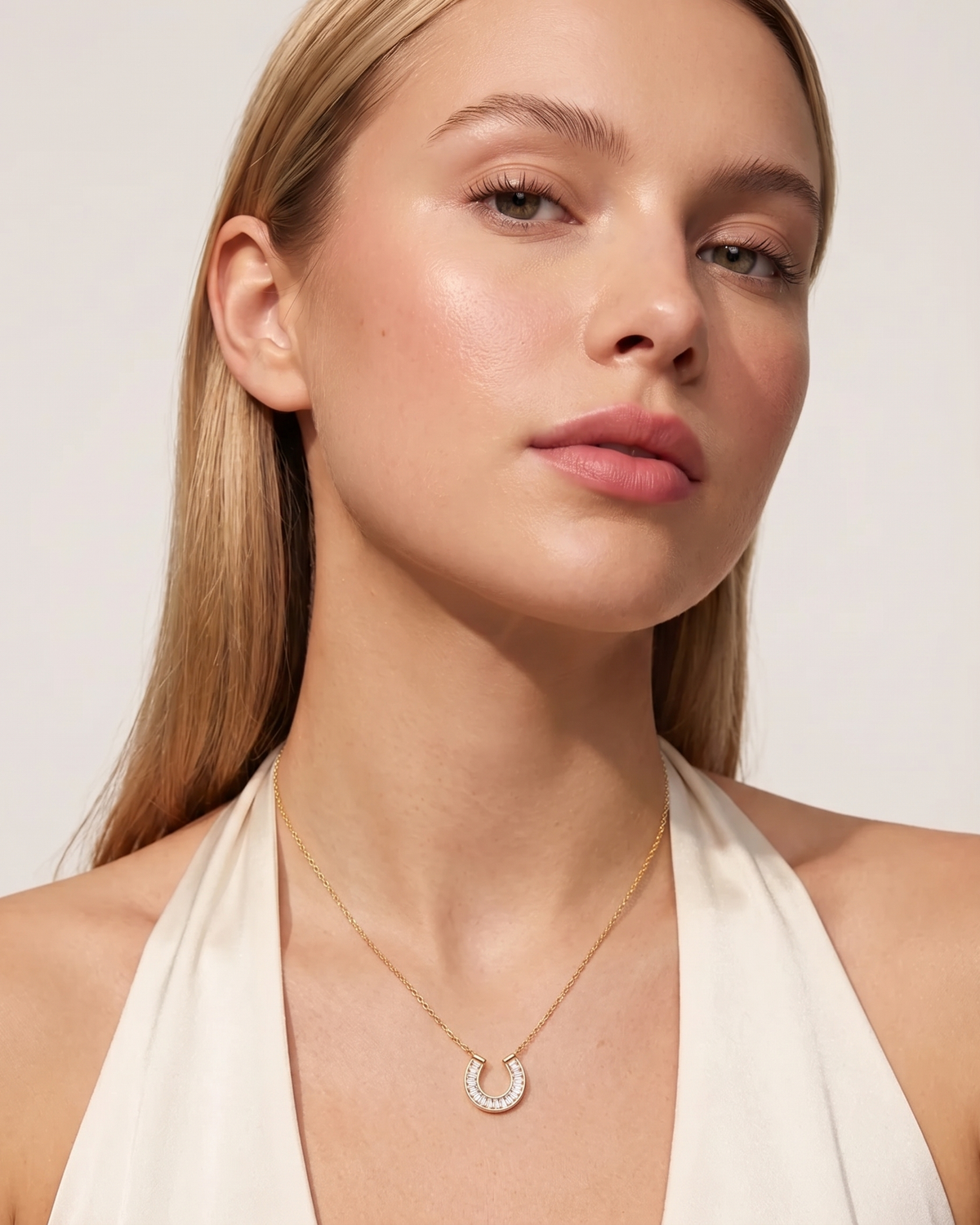 Lucky horseshoe necklace worn on model at the collarbone