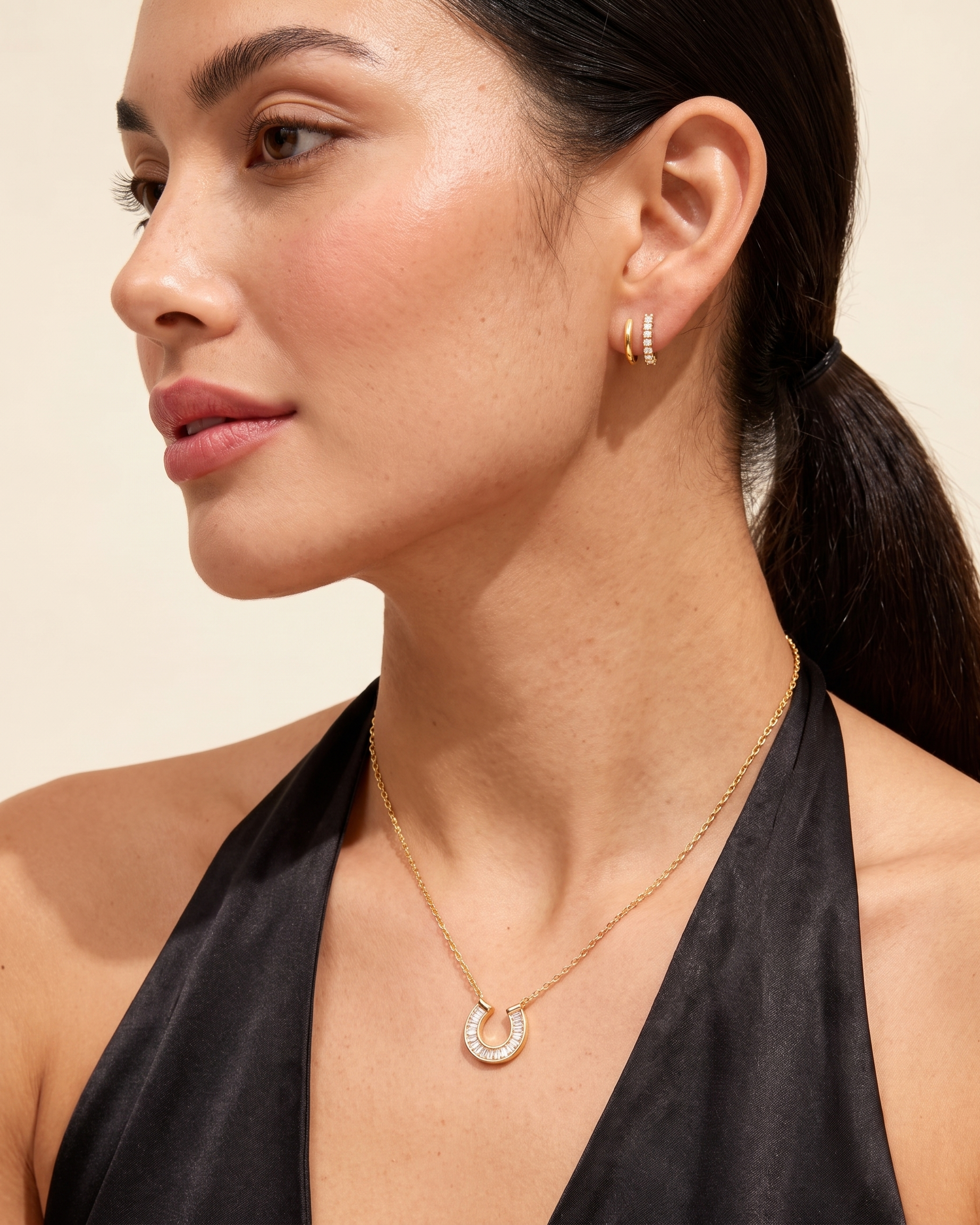 Lucky horseshoe necklace worn on model three quarter angle