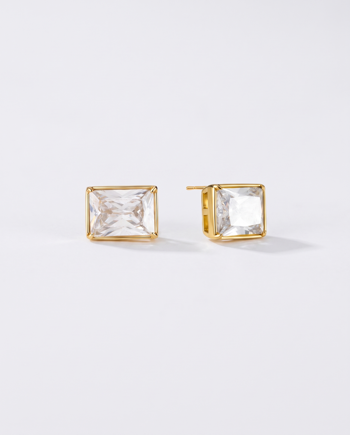 Amelie heart zircon gold stud earrings on off white background