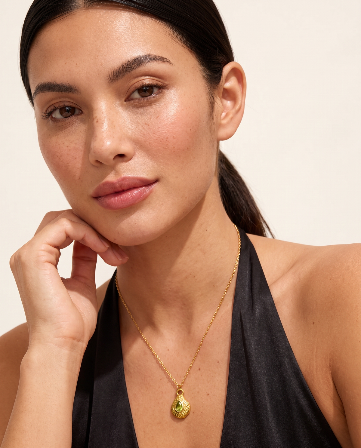 August peridot necklace worn on model second