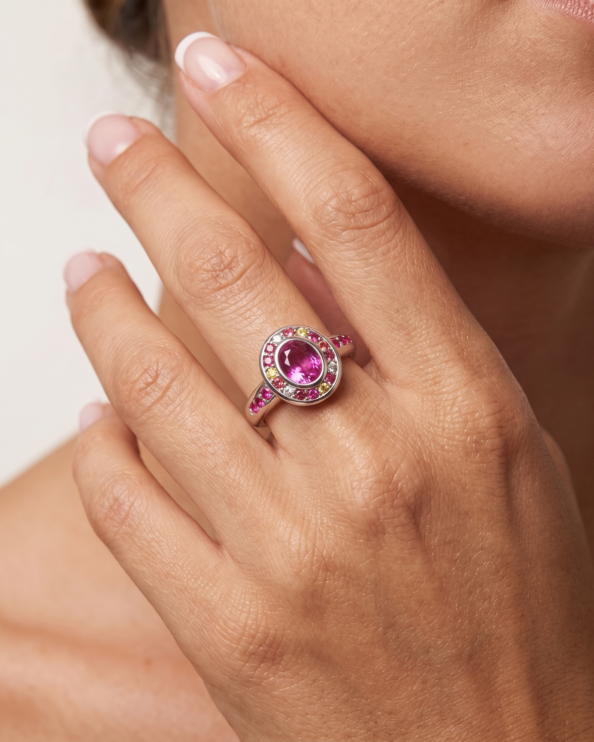 Colette silver ring worn on hand near face