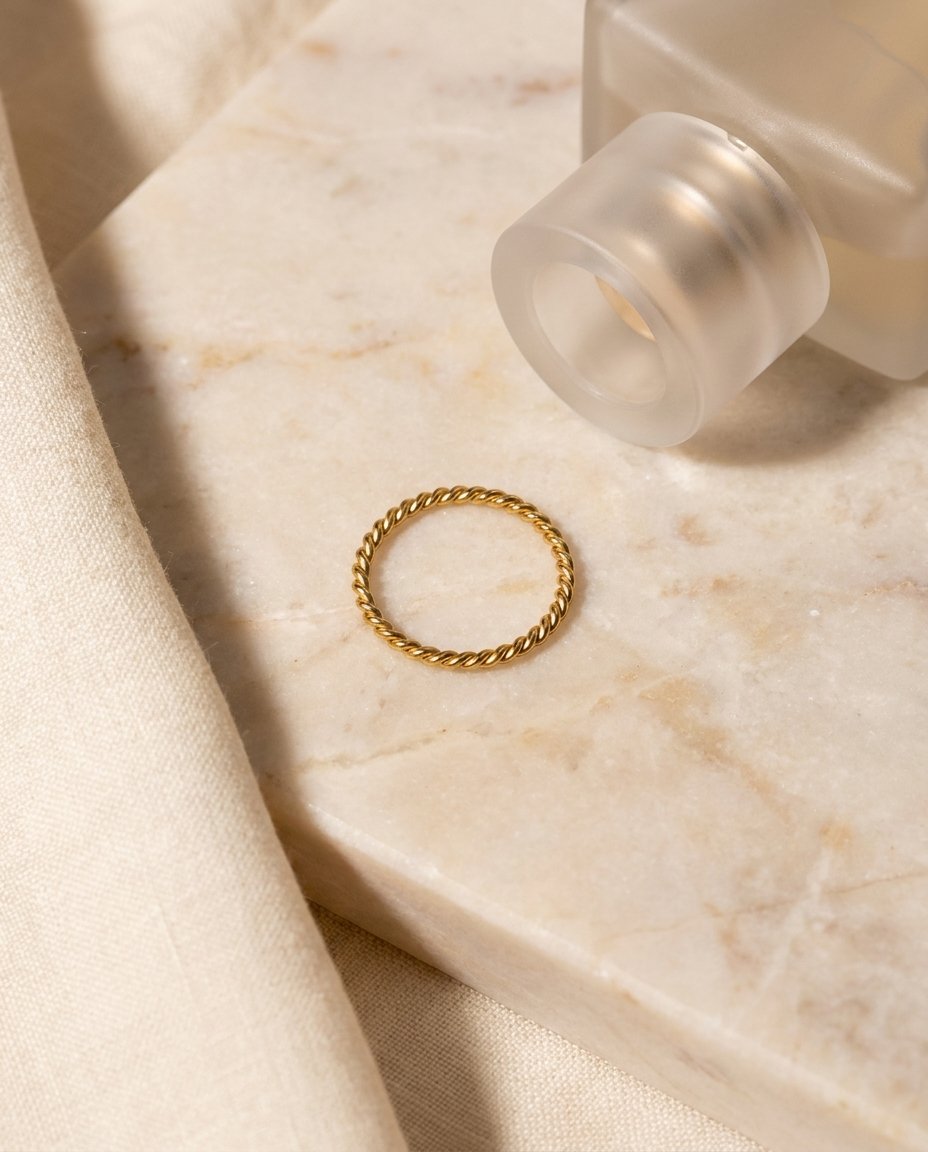 Sabine Ring flatlay on marble gold band