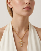 Liora Cross Necklace worn on neckline gold cross