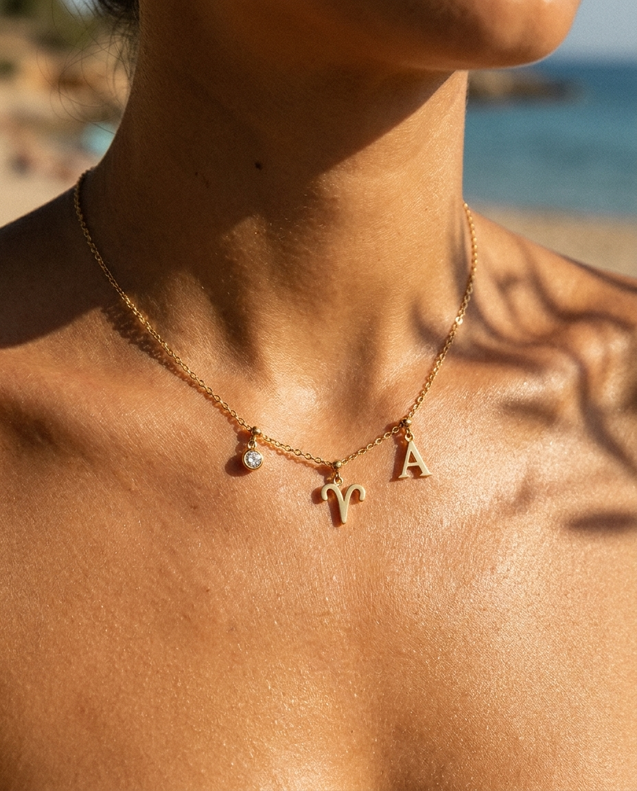Aries charm necklace worn, styled with birthstone and initial