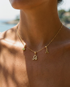 Leo zodiac charm necklace styled on model