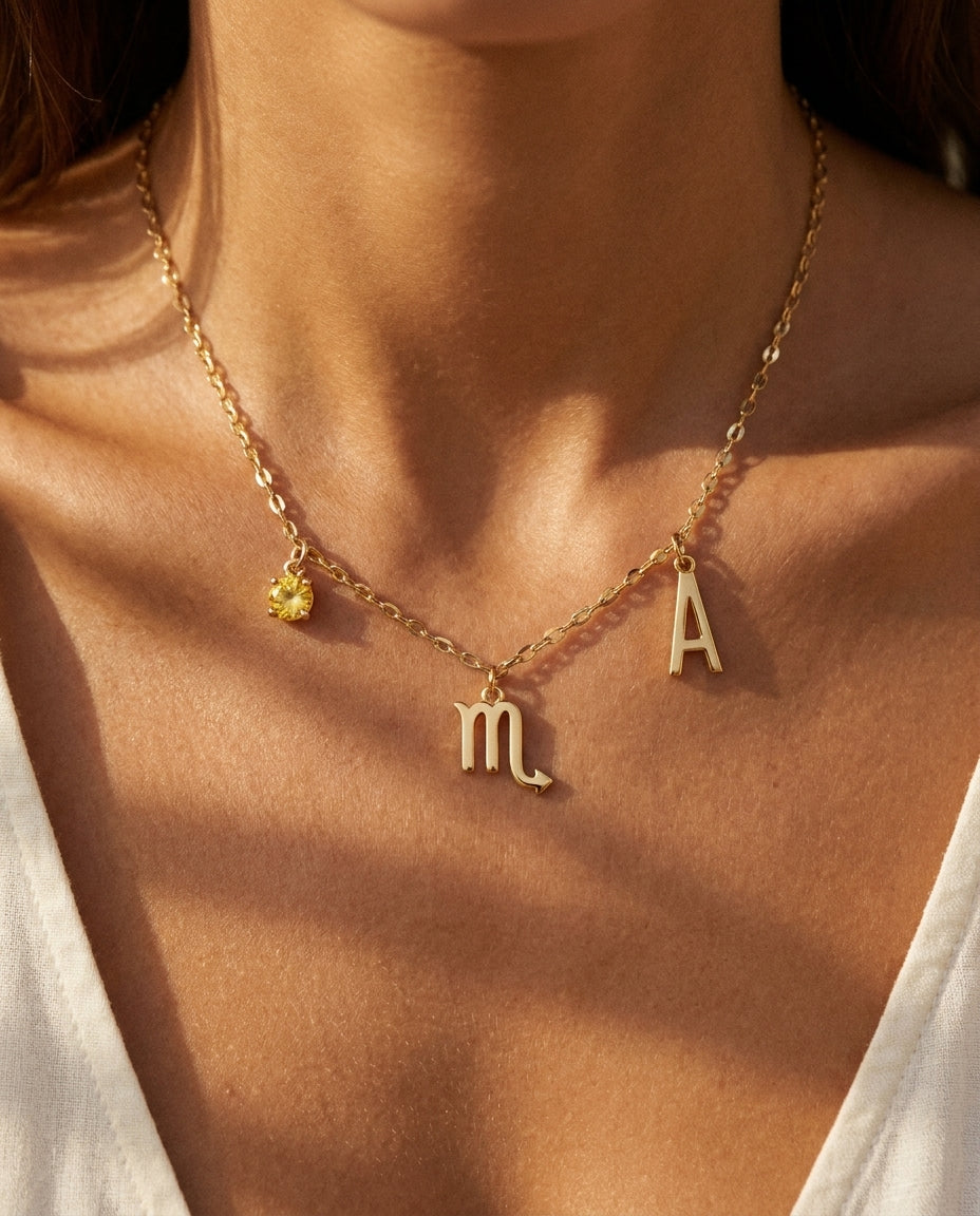 Scorpio zodiac charm necklace styled on model