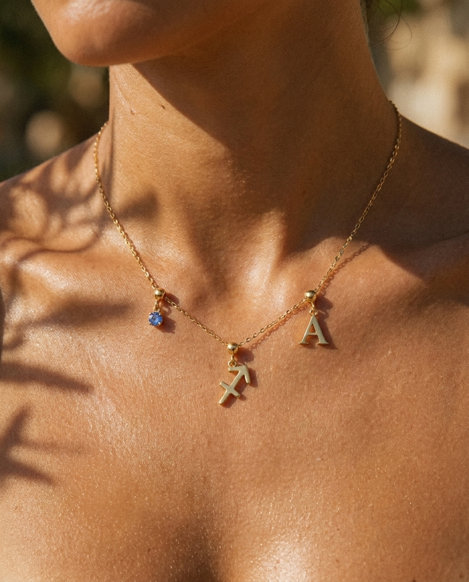 Sagittarius charm necklace worn, styled with birthstone and initial