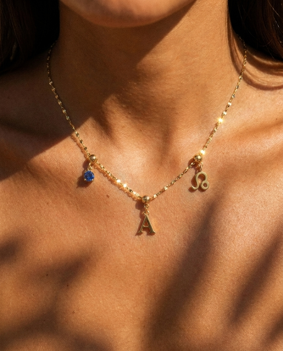 Liv Sparkle Necklace styled with gold charm cluster on model