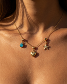 Heart charm styled with December turquoise and starfish on chain