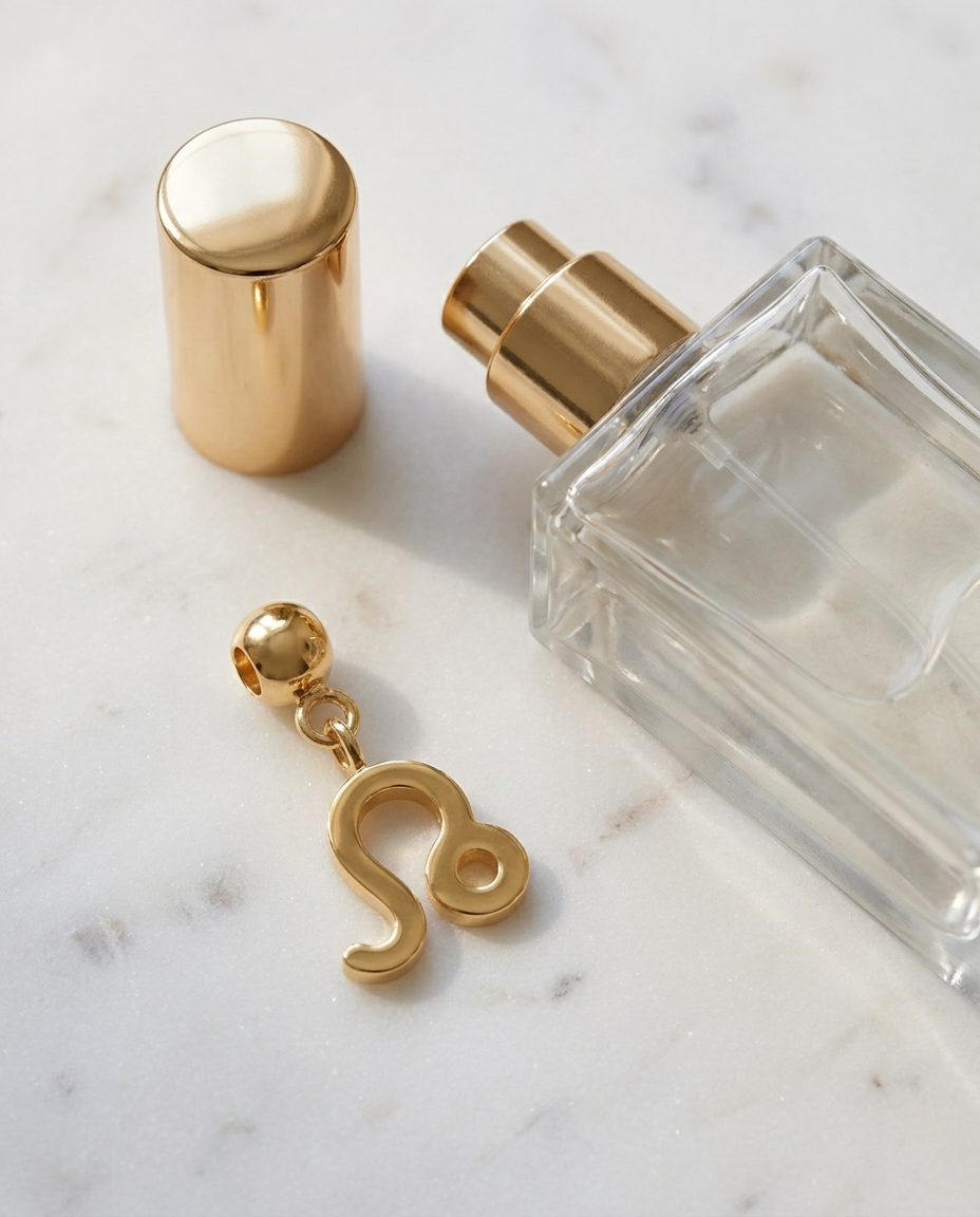Gold zodiac Leo charm flatlay, marble