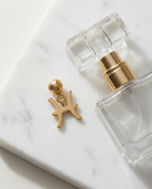 Gold zodiac Pisces charm flatlay, marble